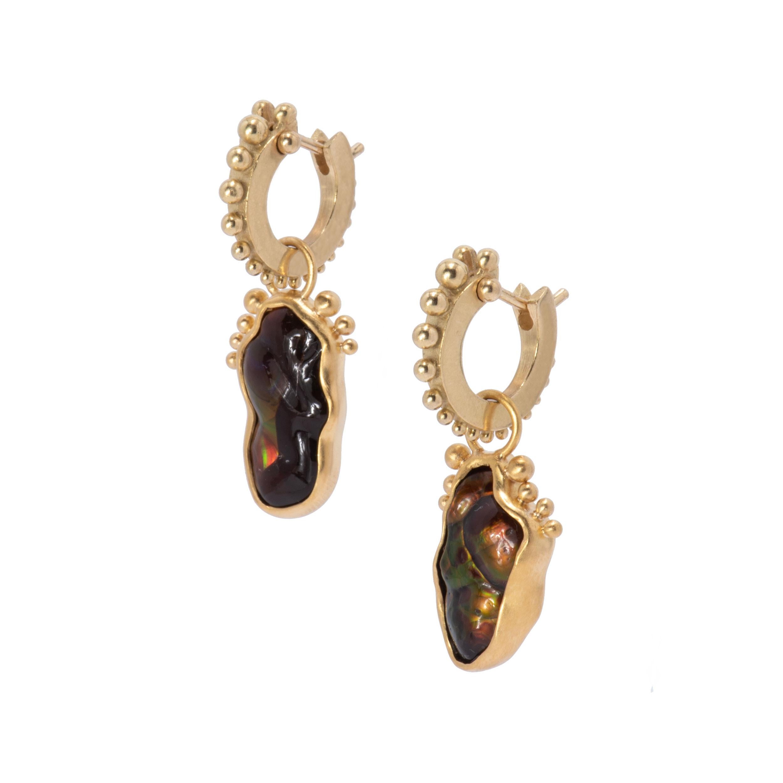 Natural fire agates glowing with orange, green, red and yellow are framed in 22 karat gold and beaded like footsteps preserved in ancient clay. Hung from 18 karat gold narrow beaded hoops which click tightly shut for security, the beading is