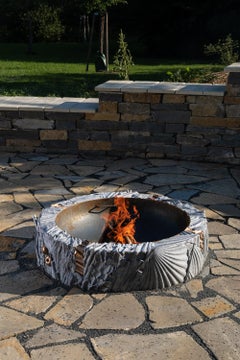 Fire element by Ondřej Oliva - sculptural fire pit, aluminum and bronze