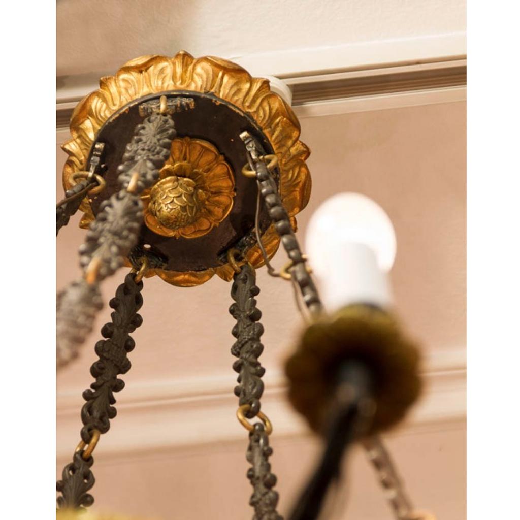 French ceiling chandelier,
formerly for use with candles, later electrified, body made of copper and cast iron, partly fire-gilded, 10 burning points with E14 sockets.
The Iron parts are in black laquer. The Lamp is refurbished and the electrical