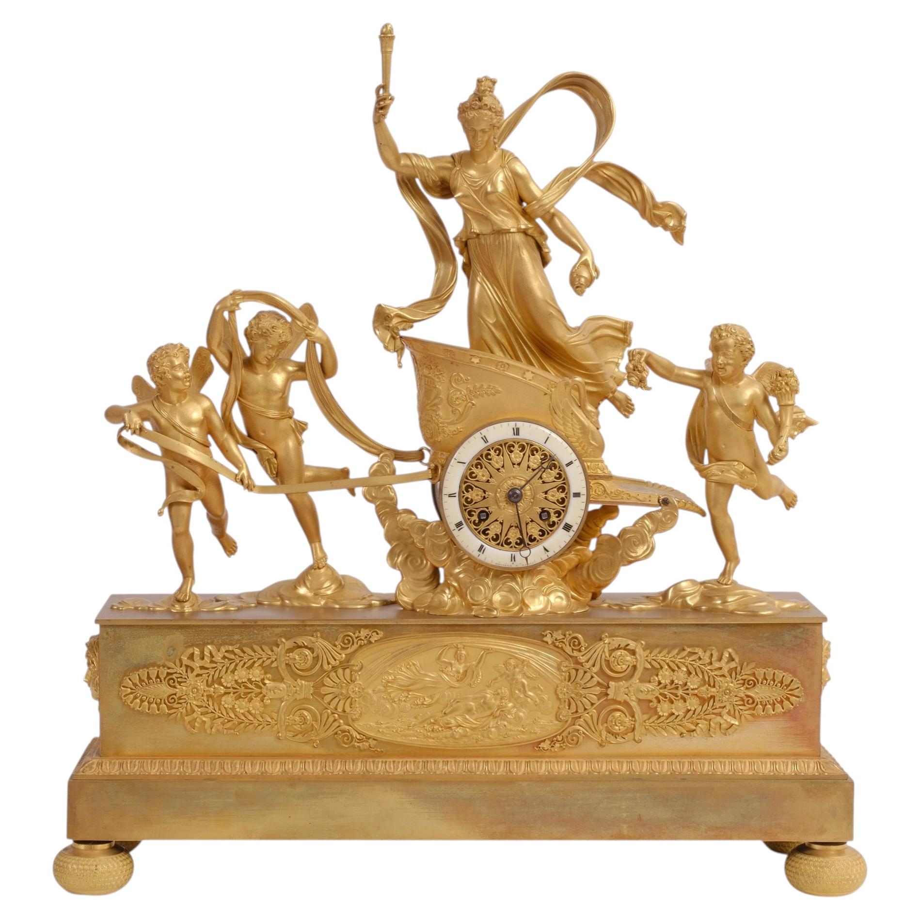 Fire-gilded French Empire bronze clock, ca. 1800, “Chariot of Aurora”; Deniere For Sale