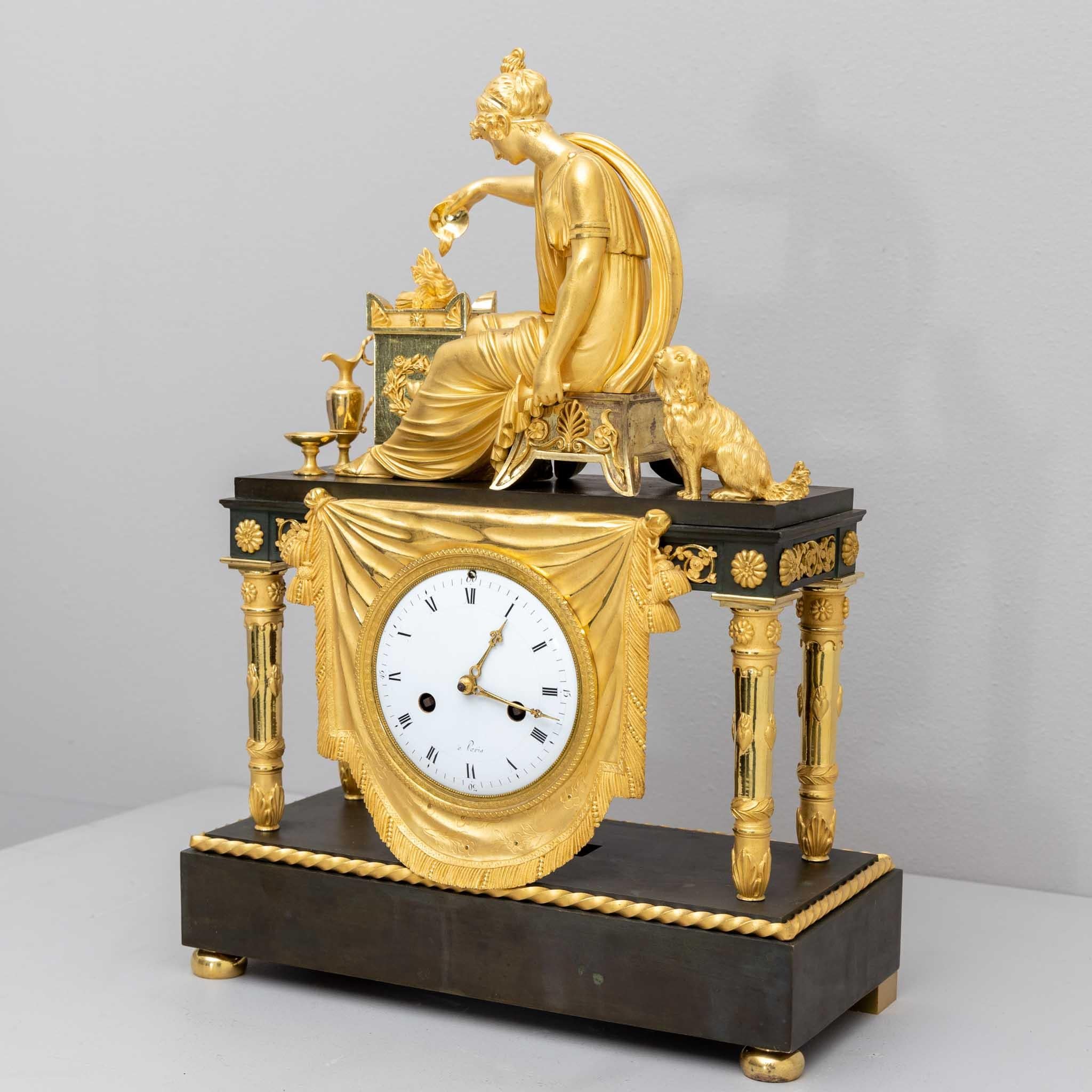 French mantel clock made of burnished and fire-gilded bronze with an enamelled dial, there inscribed 