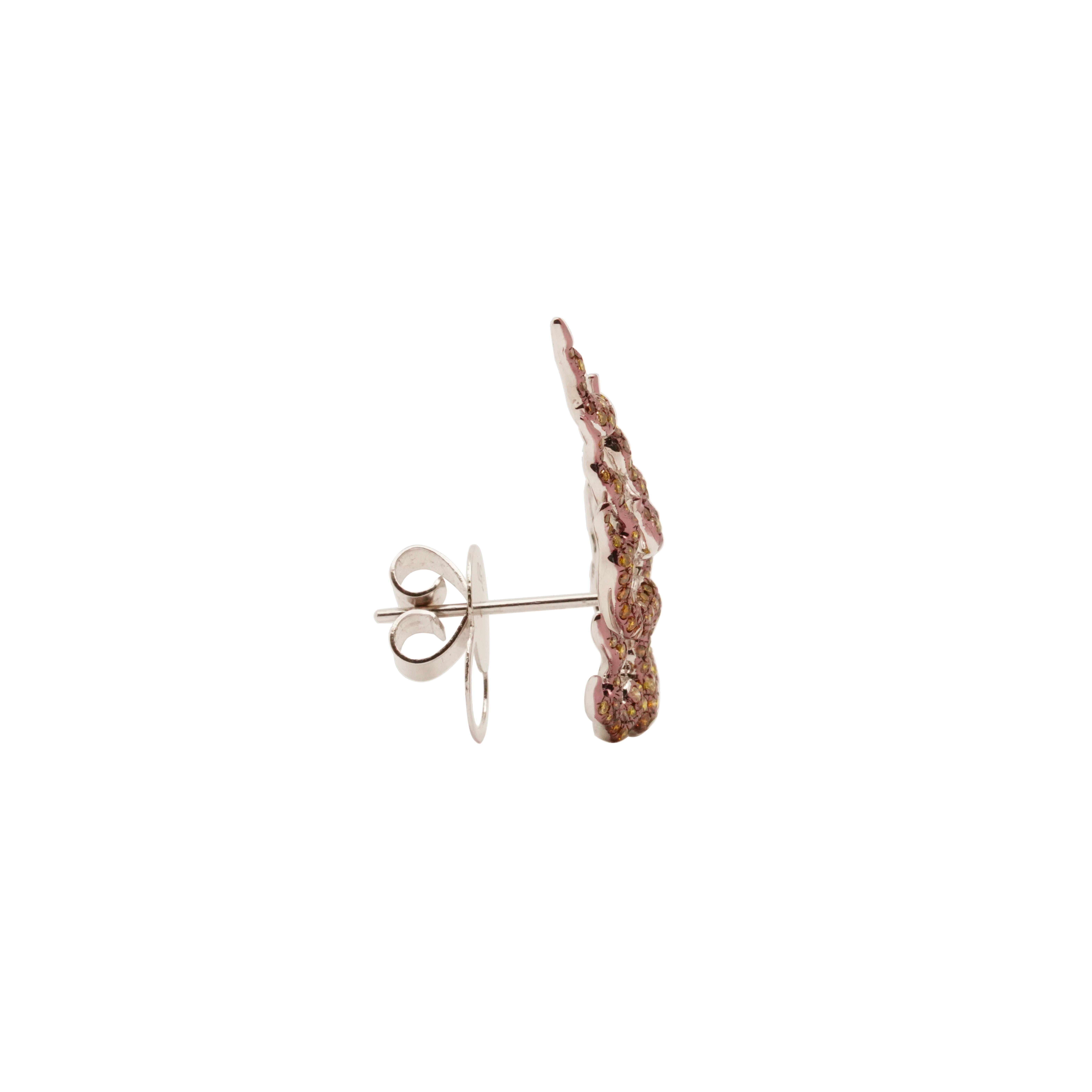 The Fire of Agni Earrings are part of the FŪRINKAZAN Collection designed by acclaimed jeweler Austy Lee. This exquisite series showcases a variety of captivating color options to suit diverse preferences.

The pair you have selected is meticulously