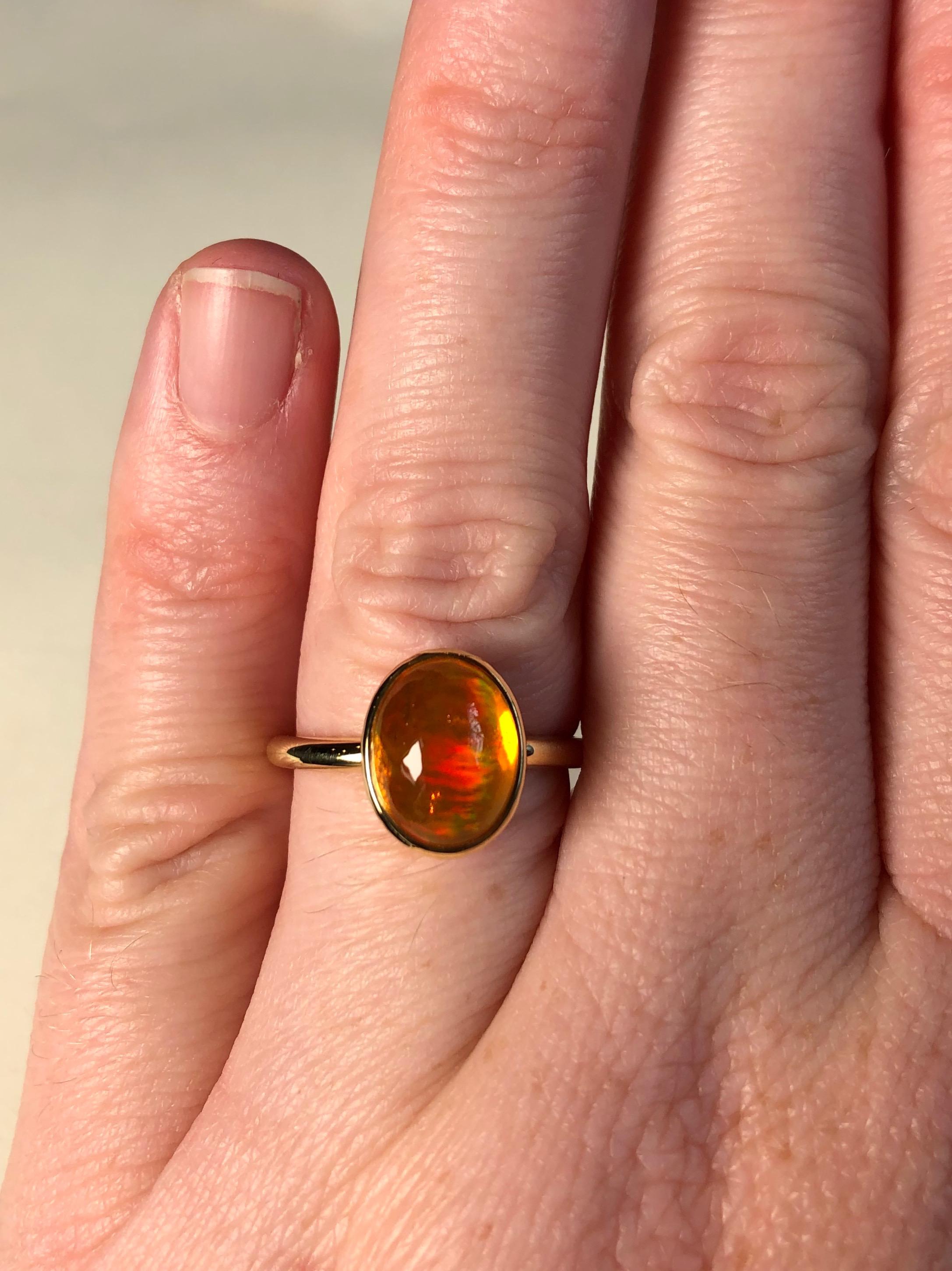 Performs miraculously in every light with incredible depth of color. Exceptional 3.01 carat Mexican fire opal, ethically sourced and hand fabricated in 100% 18 karat recycled gold 18. Part of our baroque gem collection. Polished shank, hand hammered