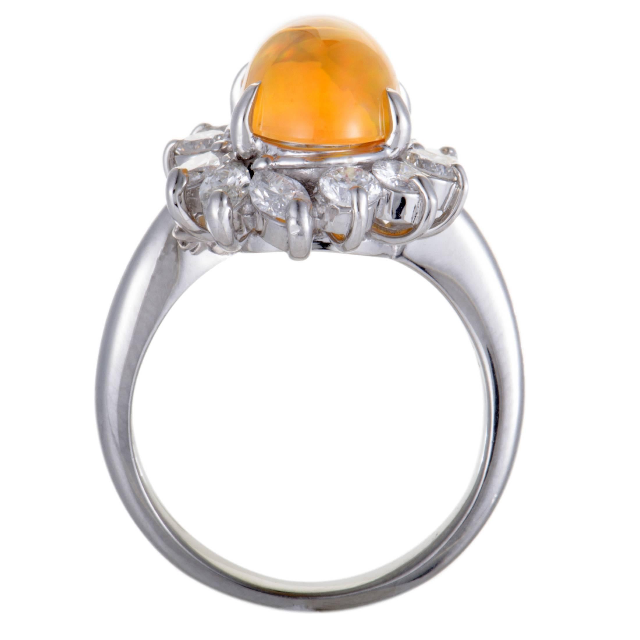 Featuring a splendidly elegant design, this ring offers an alluringly refined appearance. The attractive ring is made of classy platinum and set with 1.34ct of sparkling diamonds around a captivating fire opal, weighing 2.95ct.
Ring Top Dimensions: