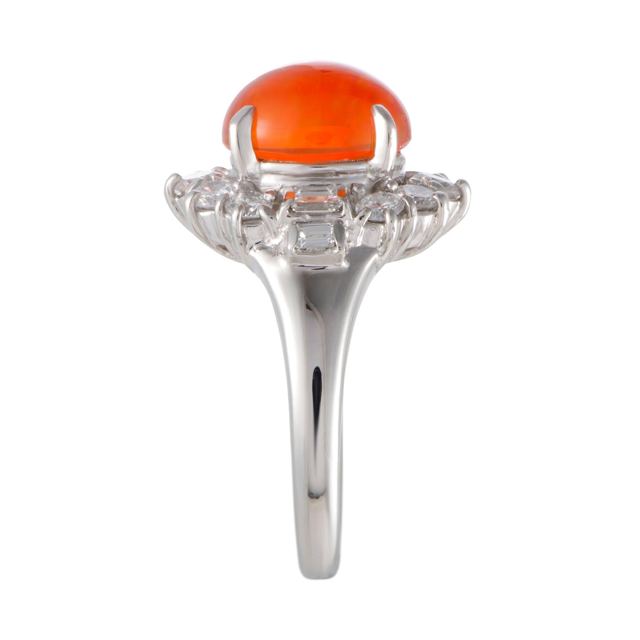 This spectacular ring is beautifully designed in classy platinum. The attractive ring is adorned in a captivating fire opal of 2.72ct and 1.14ct of stunning diamonds that immensely elevate the value of the splendid piece.
Ring Top Dimensions: 16mm x