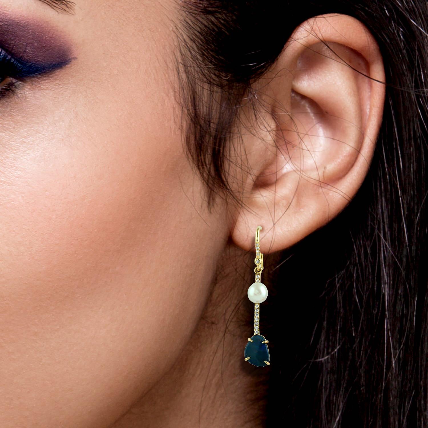 These beautiful mismatch linear drop earring are handcrafted in 14-karat gold. It is set with 1.94 carats fire opal, 0.89 carats opal doublet, .97 carats aquamarine, pearl and .15 carats of glimmering diamonds.

FOLLOW  MEGHNA JEWELS storefront to