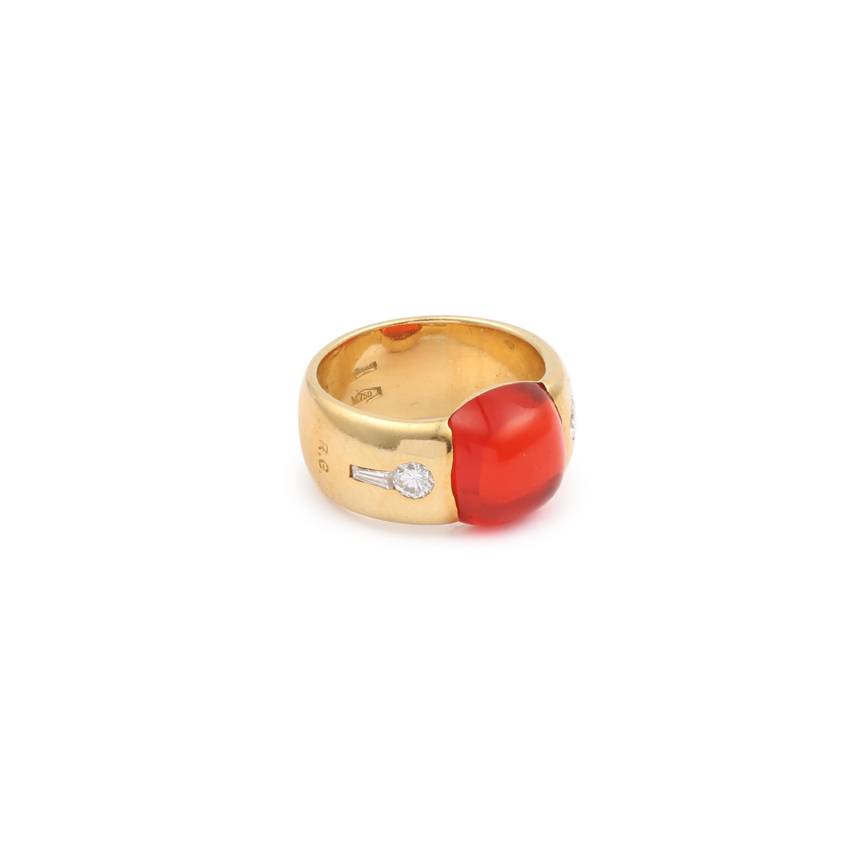 Yellow gold ring set with a fire opal cabochon and small baguette and brilliant diamonds.

Dimensions : 10.10 x 19.47 x 5.49 mm (0.397 x 0.766 x 0.216 inch)

Estimated weight of the opal : 3 carats

Total estimated weight of the diamonds : 0.30
