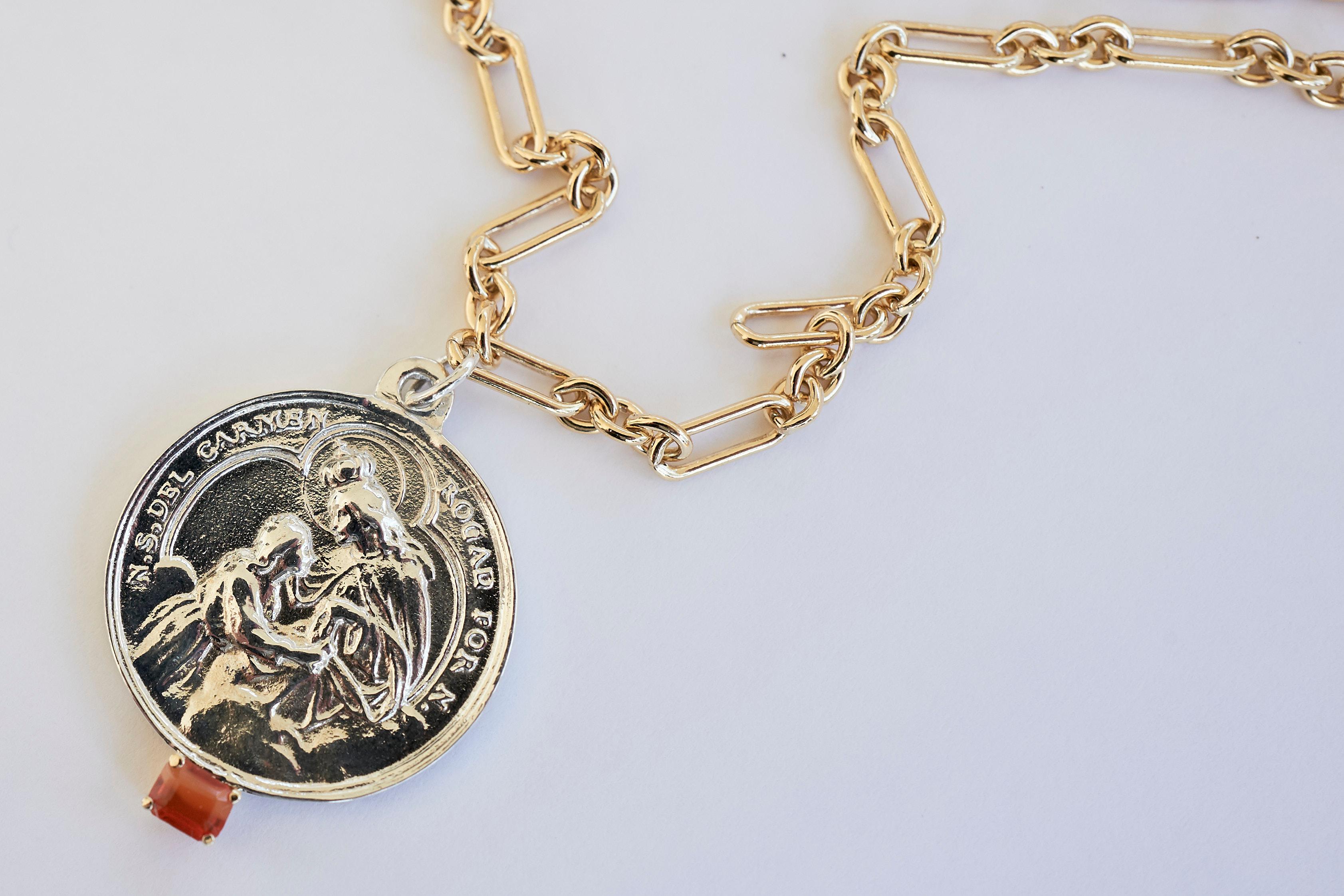 Fire Opal  Gold Filled Chain Necklace Virgin Mary Medal Silver Pendant J Dauphin

Exclusive piece with a Round Virgin Mary Medal in Silver with an Fire Opal Baguette Cut set in a Gold Prong prong and with a gold filled Chain. Necklace is 24