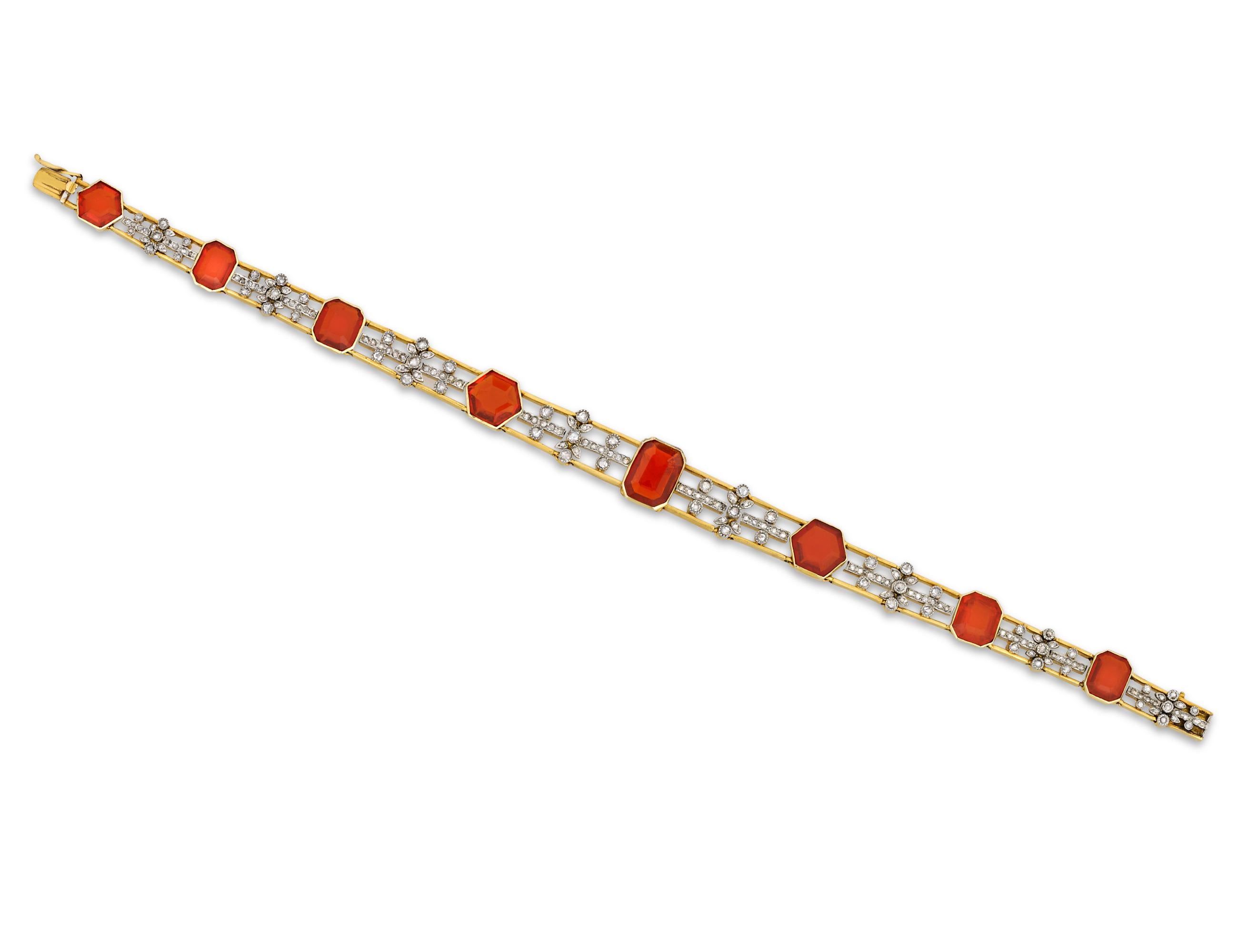 The vibrance of Mexican fire opals is balanced by glistening diamonds in this Edwardian necklace. The versatile piece's length is adjustable so that it can convert from a choker necklace to a bracelet. These rare faceted opals, weighing a total of