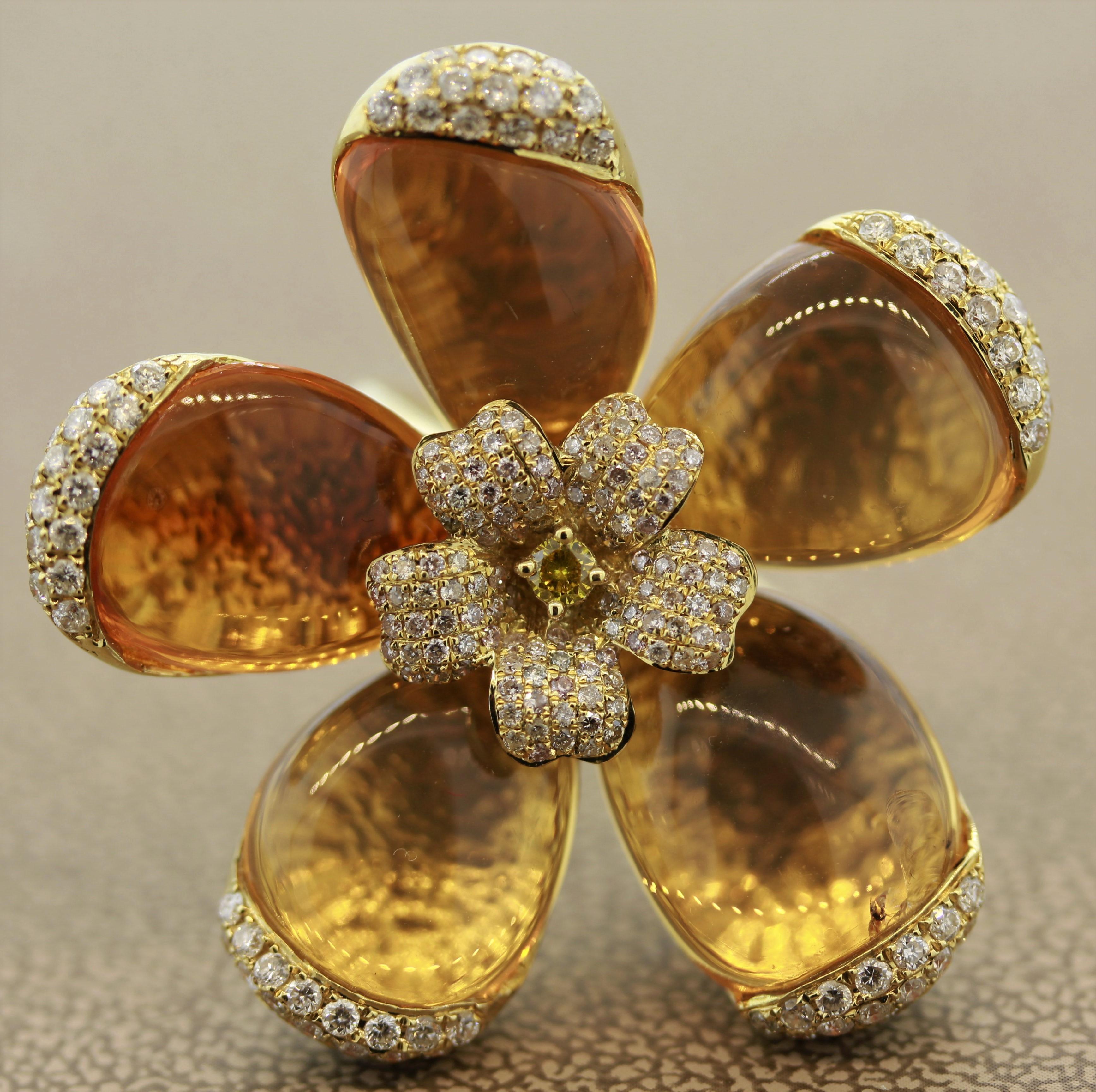 A unique flower ring featuring 5 pieces of fire opal which are used as the flower’s petals. Accenting the pieces are 1.33 carats of round brilliant cut diamonds which are set all around the ring, along with one larger fancy yellow diamond in the