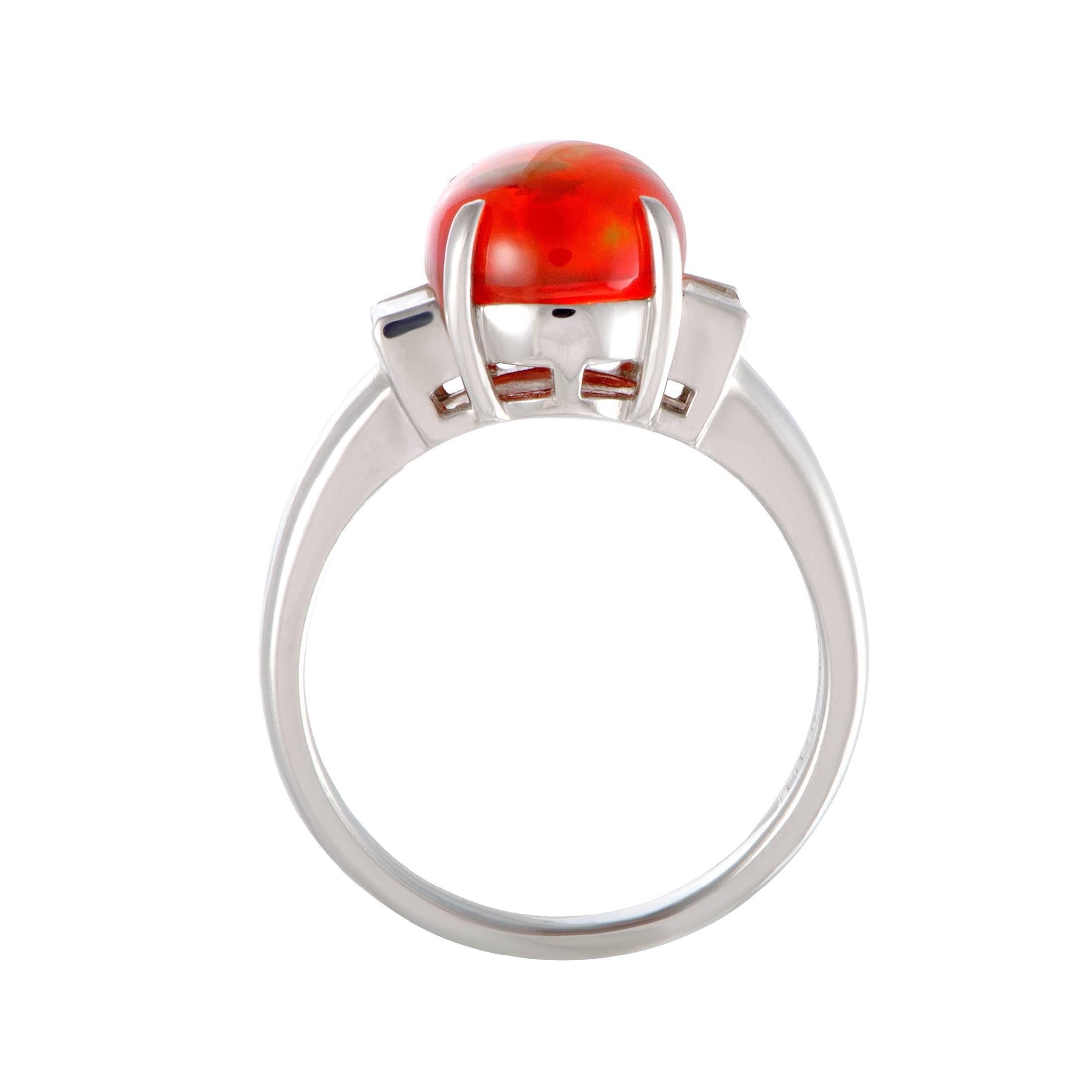 Captivating your gaze in the most stylish manner, the fire opal adds a compelling pop of color to this splendid platinum ring. The opal weighs 2.85 carats, and it is accompanied by diamonds that amount to 0.30 carats.
Ring Top Dimensions: 10mm x