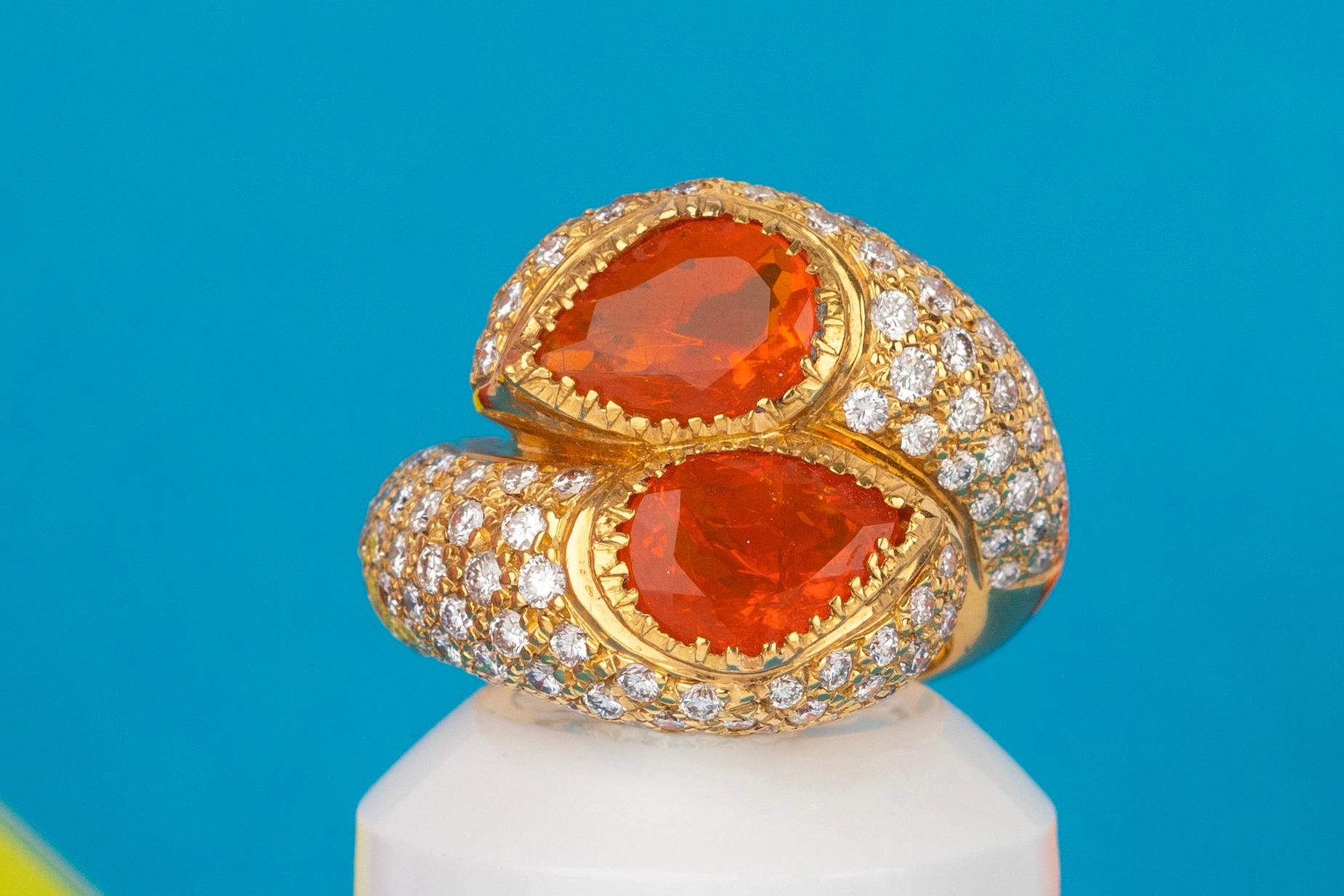 19.2K Yellow Gold Fire Opal and Diamond Ring, Consisting of two Stones With 2 Carats Each, Surrounded By Diamonds Brilliant Cut having Total Weight of 3,66 Carats.
Because of the inside of the sing the size is between:
USA Size 7.75
UK Size P