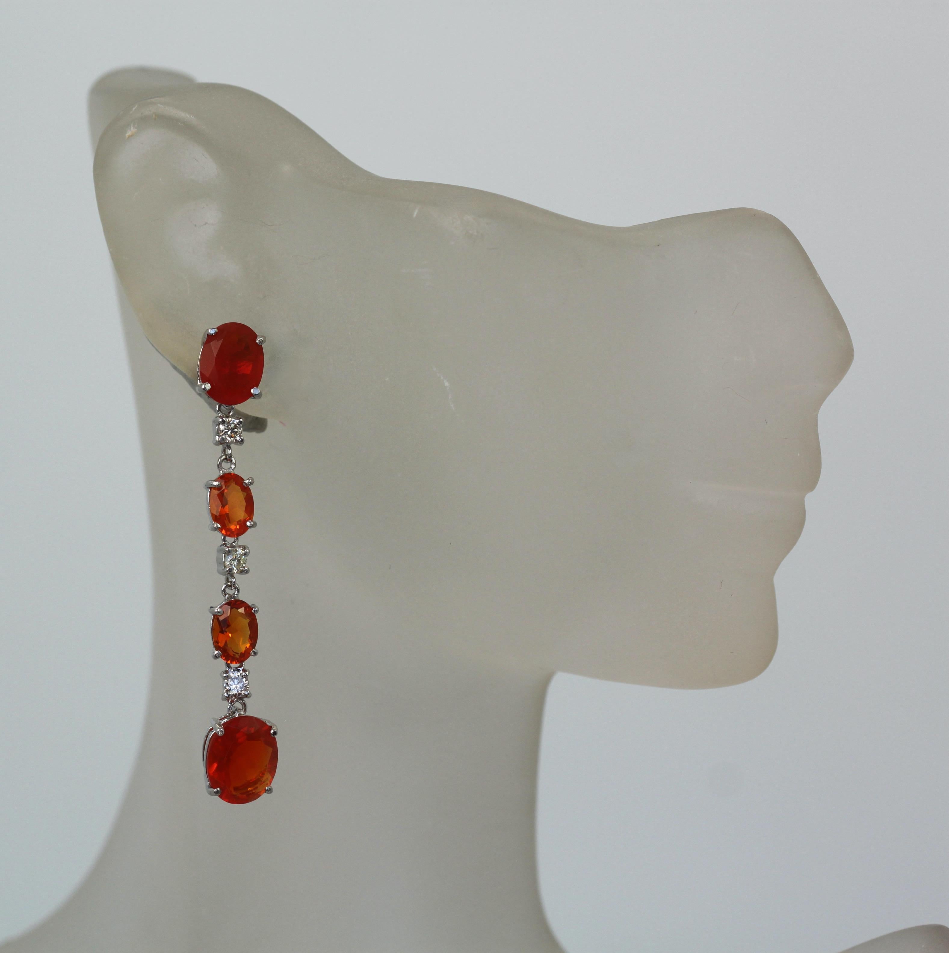 These Fire Opal Earrings match the the Huge Fire Opal ring listed in another listing.  These consist of 4 Fire Opals and set in between with Diamonds.  Faucted Fire Opal is rare and these are a perfect match.  These earrings weigh 7.0 grams 4 opals