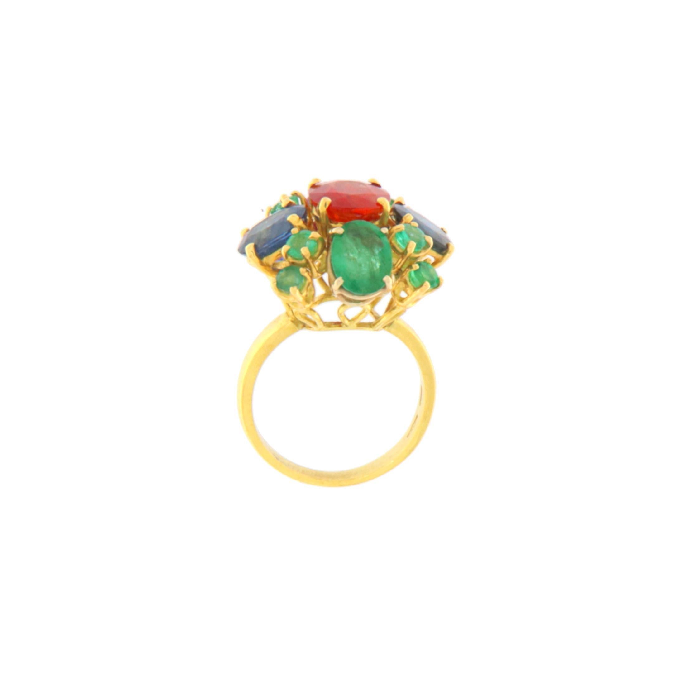 This stunning ring is crafted in 18-karat yellow gold, a precious metal that provides timeless elegance, durability, and lasting value. At the center of the setting shines a magnificent fire opal, a gemstone with an intense red-orange hue that