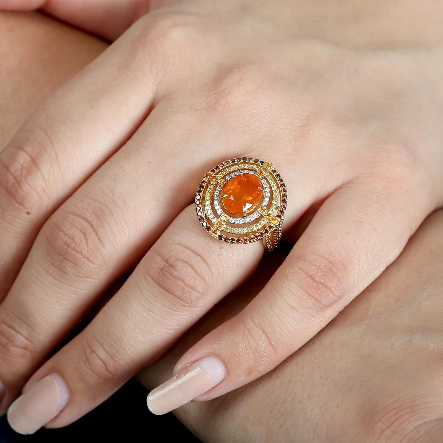 This ring has been meticulously crafted from 18-karat gold, 2.31 carat fire opal, garnet and handset with .92 carats of sparkling diamonds.

The ring is a size 7 and may be resized to larger or smaller upon request. 
FOLLOW  MEGHNA JEWELS storefront