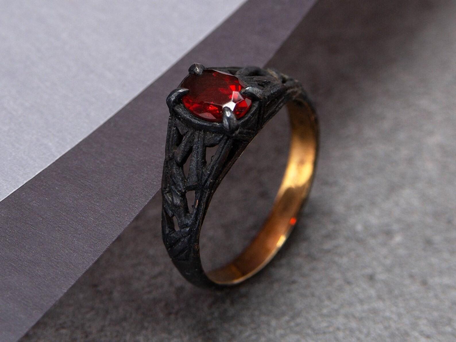 Blackened and gold plated silver ring with natural Fire Opal 
opal origin - Mexico
opal weight - 0.55 carats
opal measurements - 0.20 x 0.28 in / 5 x 7 mm 
ring weight - 2.88 grams
ring size - 7.25 US