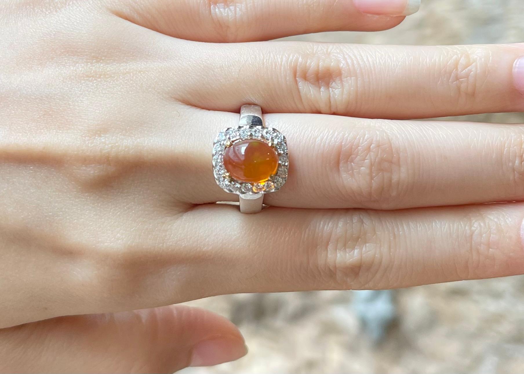 Fire Opal 2.99 carats with Diamond 0.48 carat Ring set in 18K White Gold Settings

Width:  1.2 cm 
Length: 1.4 cm
Ring Size: 54
Total Weight: 8.17 grams

