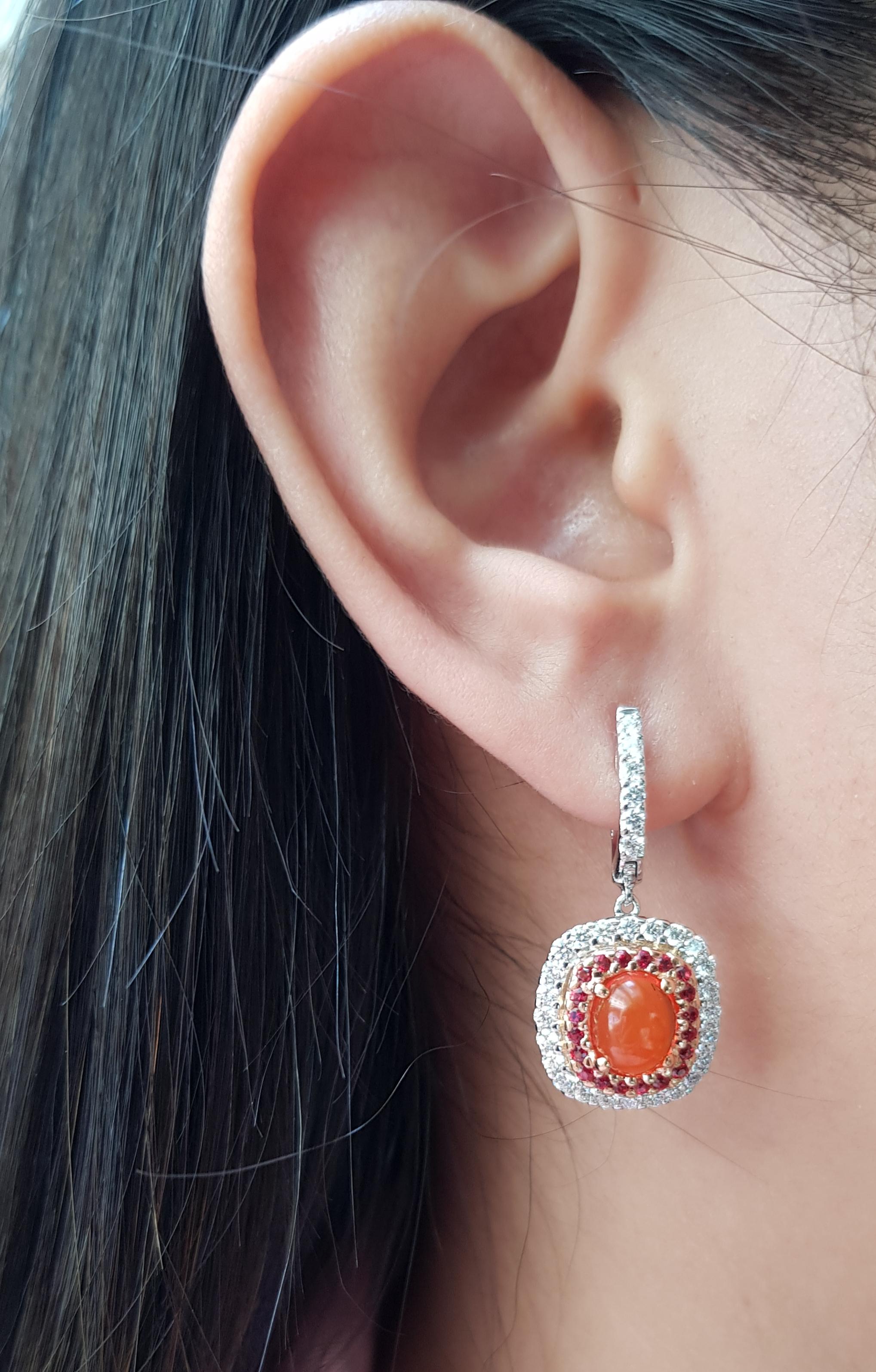Fire Opal 2.21 carats with Orange Sapphire 0.58 carat and Diamond 1.12 carats Earrings set in 18 Karat White Gold Settings

Width: 1.5 cm
Length: 3.2 cm 

