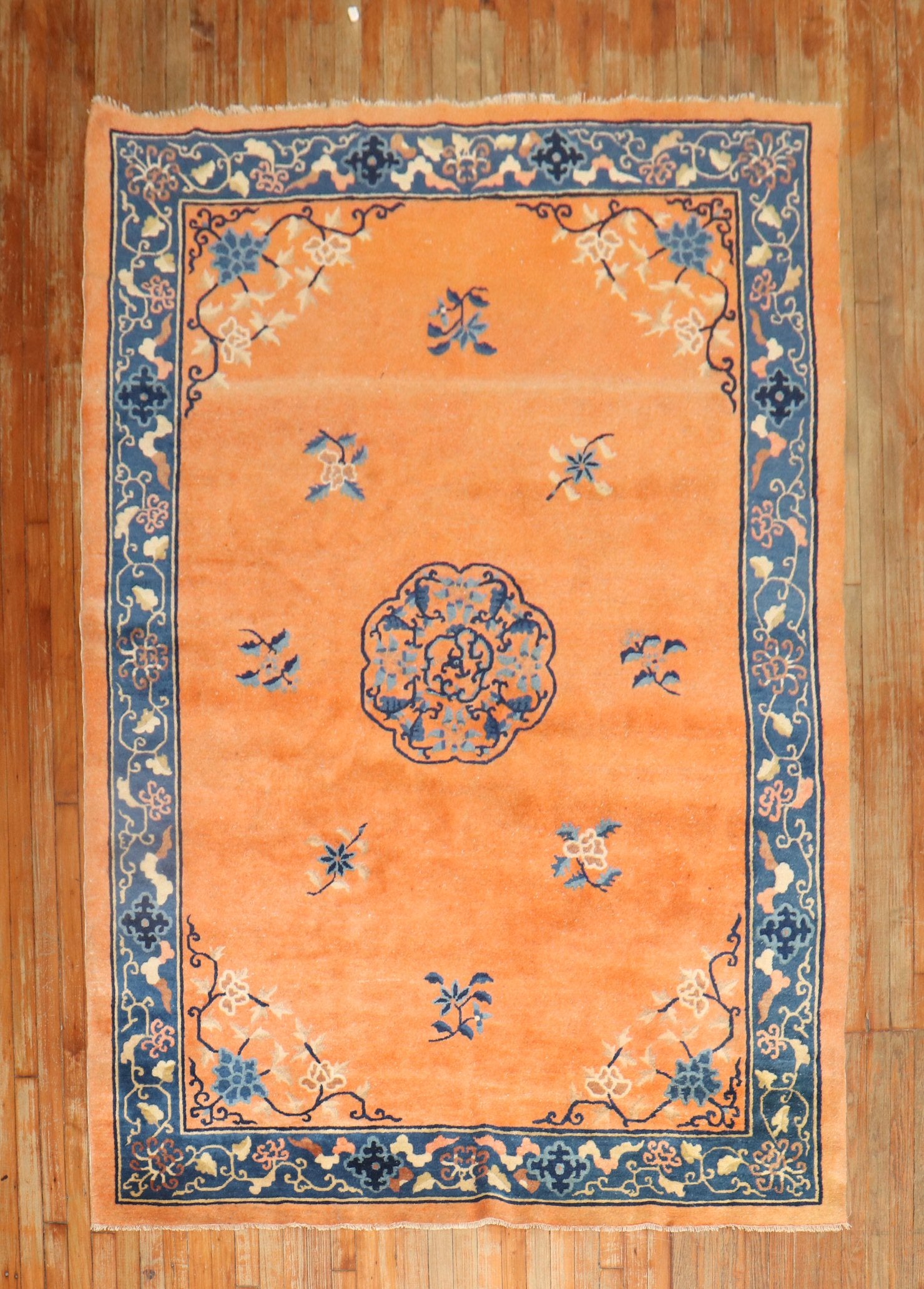 1930s Chinese Peking rug in a rare fire orange color

Measures: 5' 11