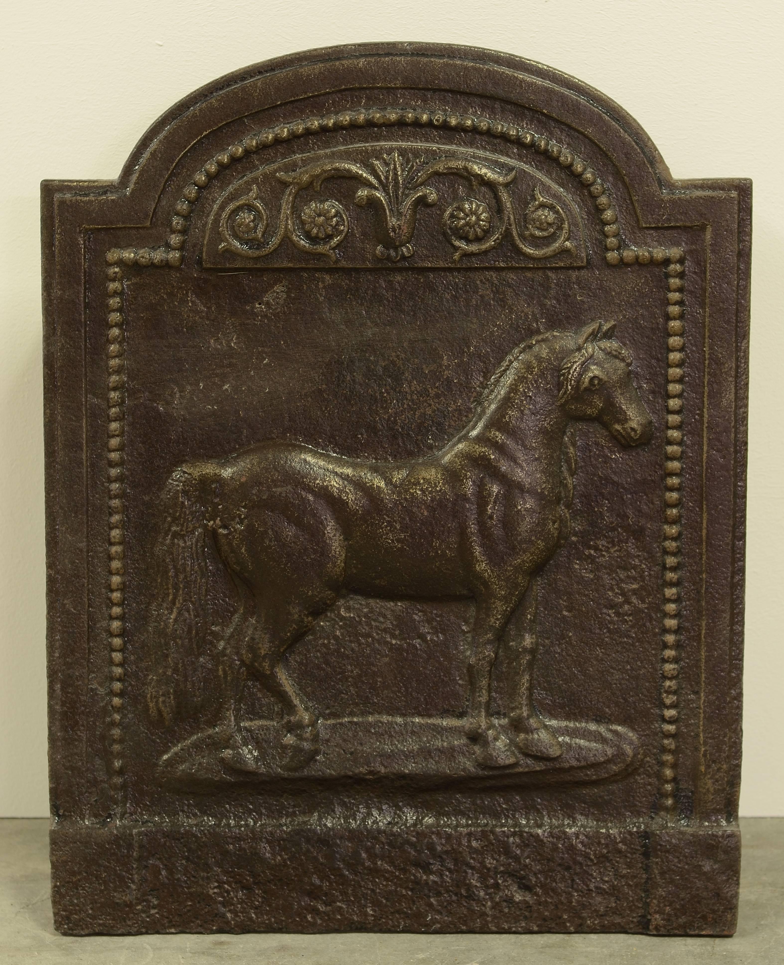 Small and very decorative fireback showing a beautiful detailed horse, amazing 