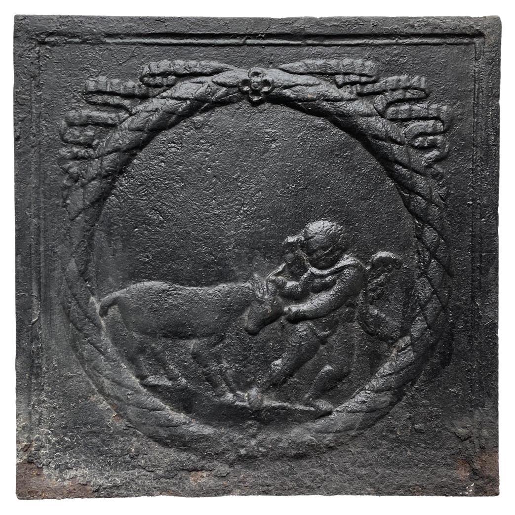 Fireback from the 18th Century Featuring a Love Playing with a Goat For Sale