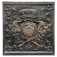 Fireback from the 19th Century with a Shield Decorated with a Sunflower