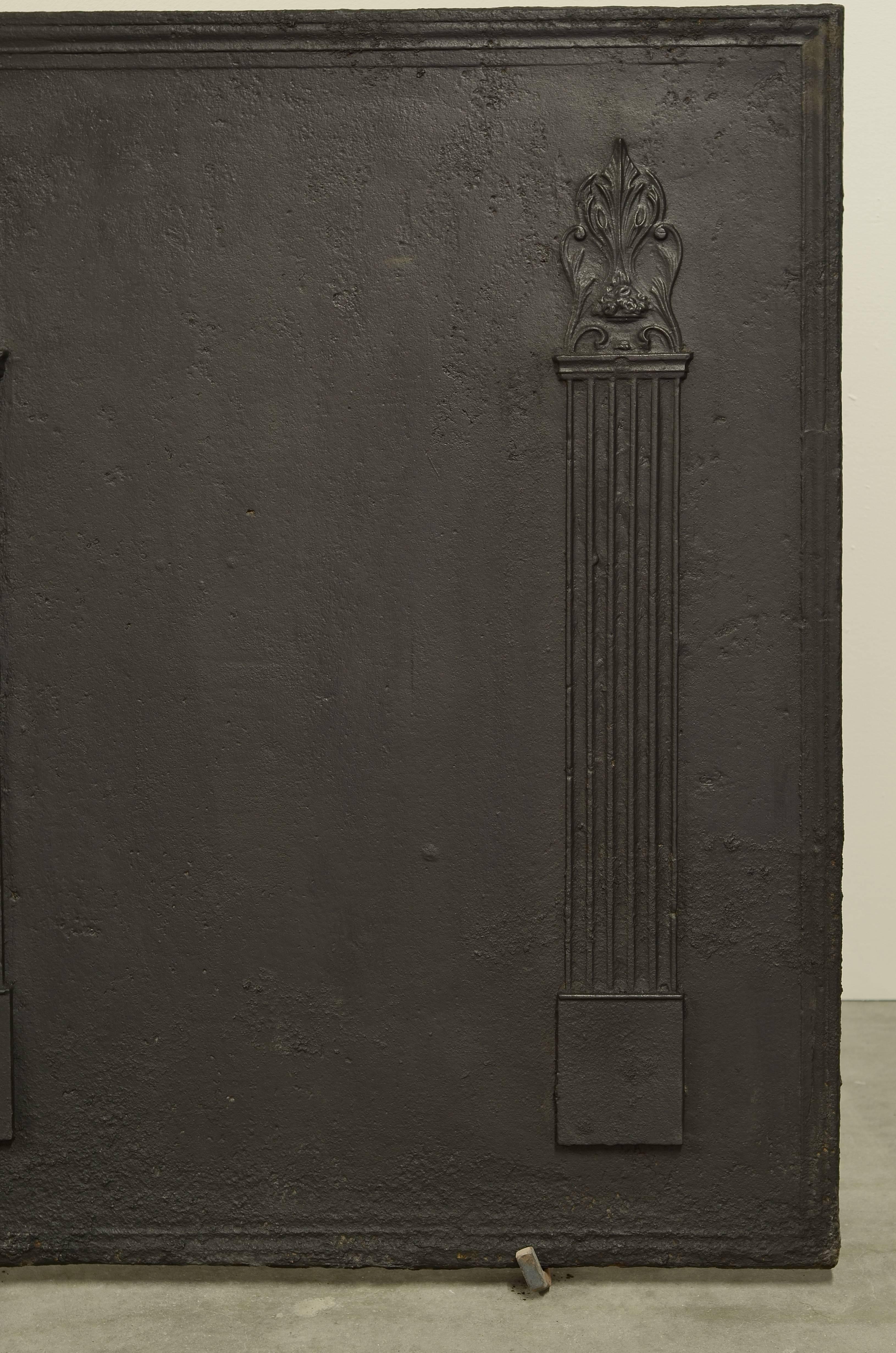 Large antique cast iron fireback with two tall pillars.

Excellent condition, can be used in a fireplace or as backsplash.

Can be supplied with stand.
   