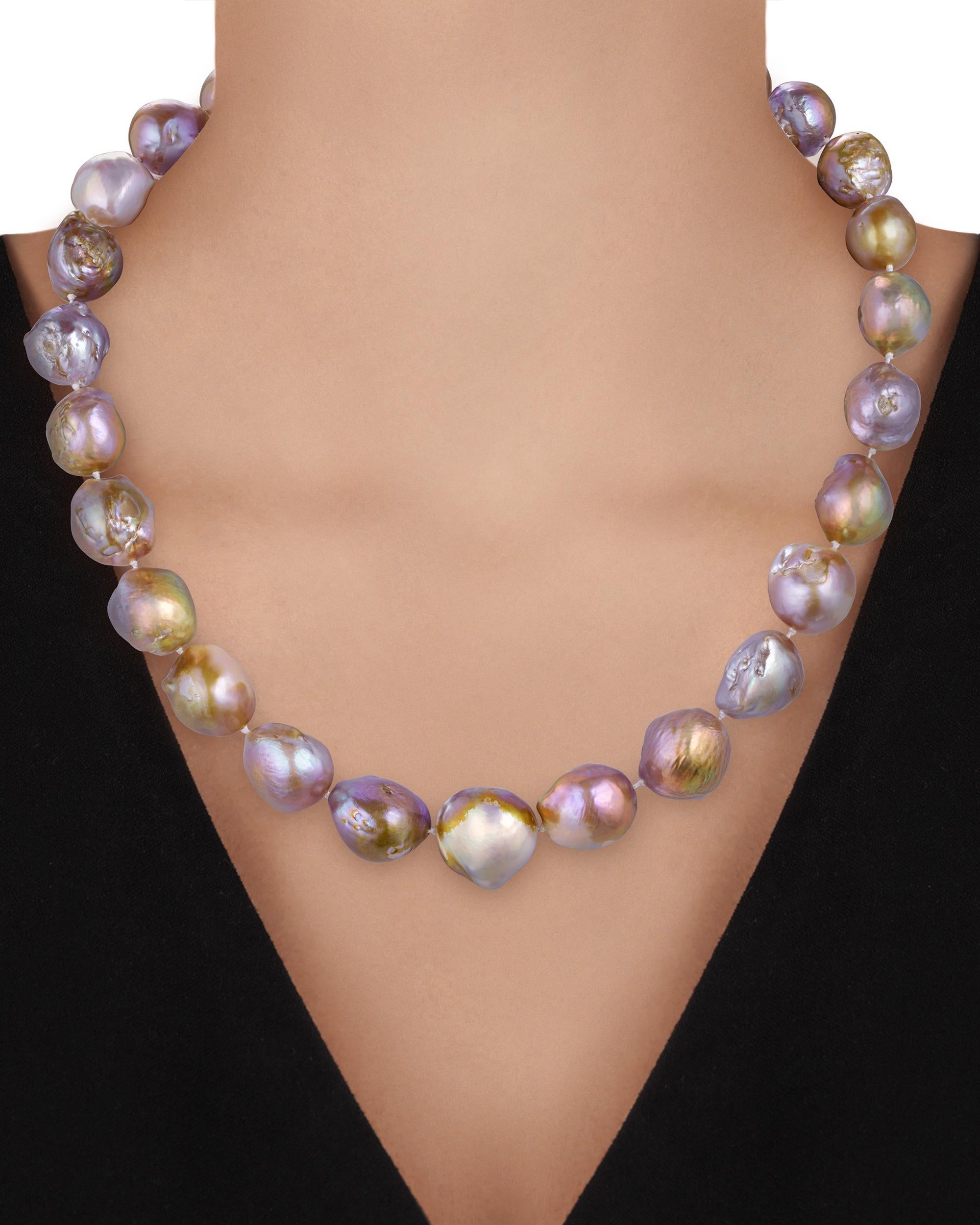 Multi-colored pearls drape gracefully around the neck in this necklace from American jewelry designer Paula Crevoshay. These iridescent, Baroque pearls are called 