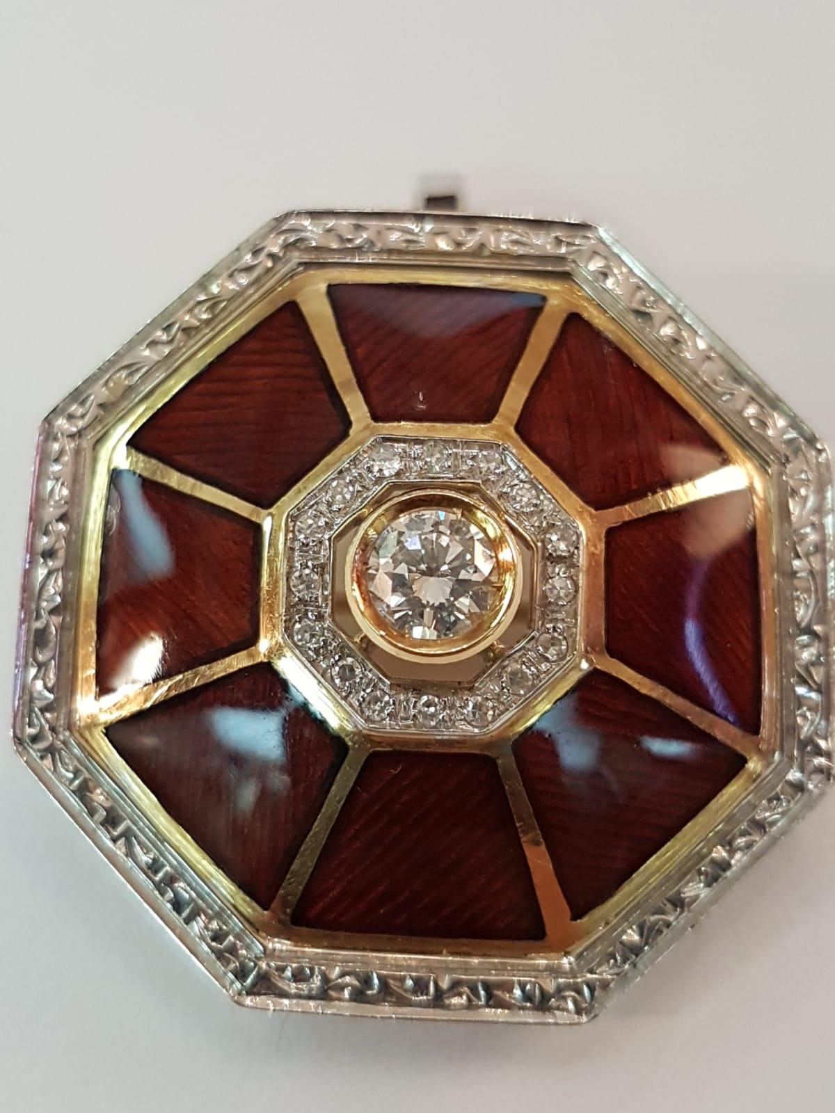 This piece of jewelry is a beautiful example of the Art of Enameling. It brings tradition of enameling into the late 20th century, making it a precious work of wearable art for today. Handcrafted, it features 0,70ct diamonds on white gold and yellow