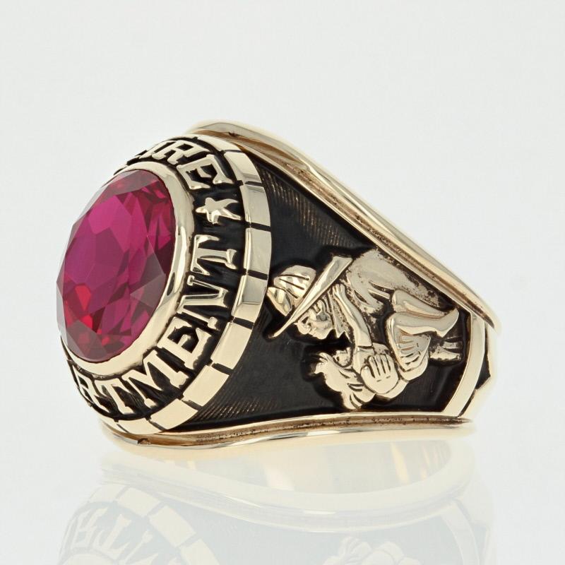 Honor the firefighter in your life with this handsome ring! Crafted in 10k yellow gold, this piece showcases a vibrant synthetic ruby framed by a border which reads “Fire Department”. The ring’s tapered shoulders display firefighting emblems and a