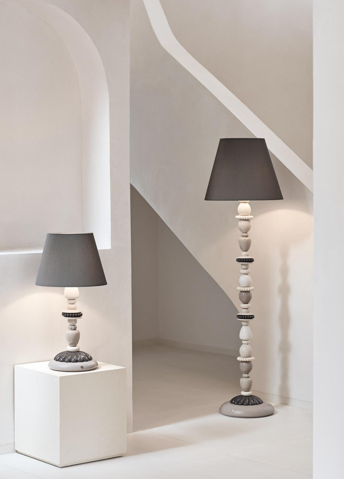 Floor lamp made in porcelain from the Firefly collection. Floor lamp from the Firefly collection, a series of original lighting designs with plant patterns. The lamp’s porcelain elements are decorated in shades of cream, beige and taupe with the