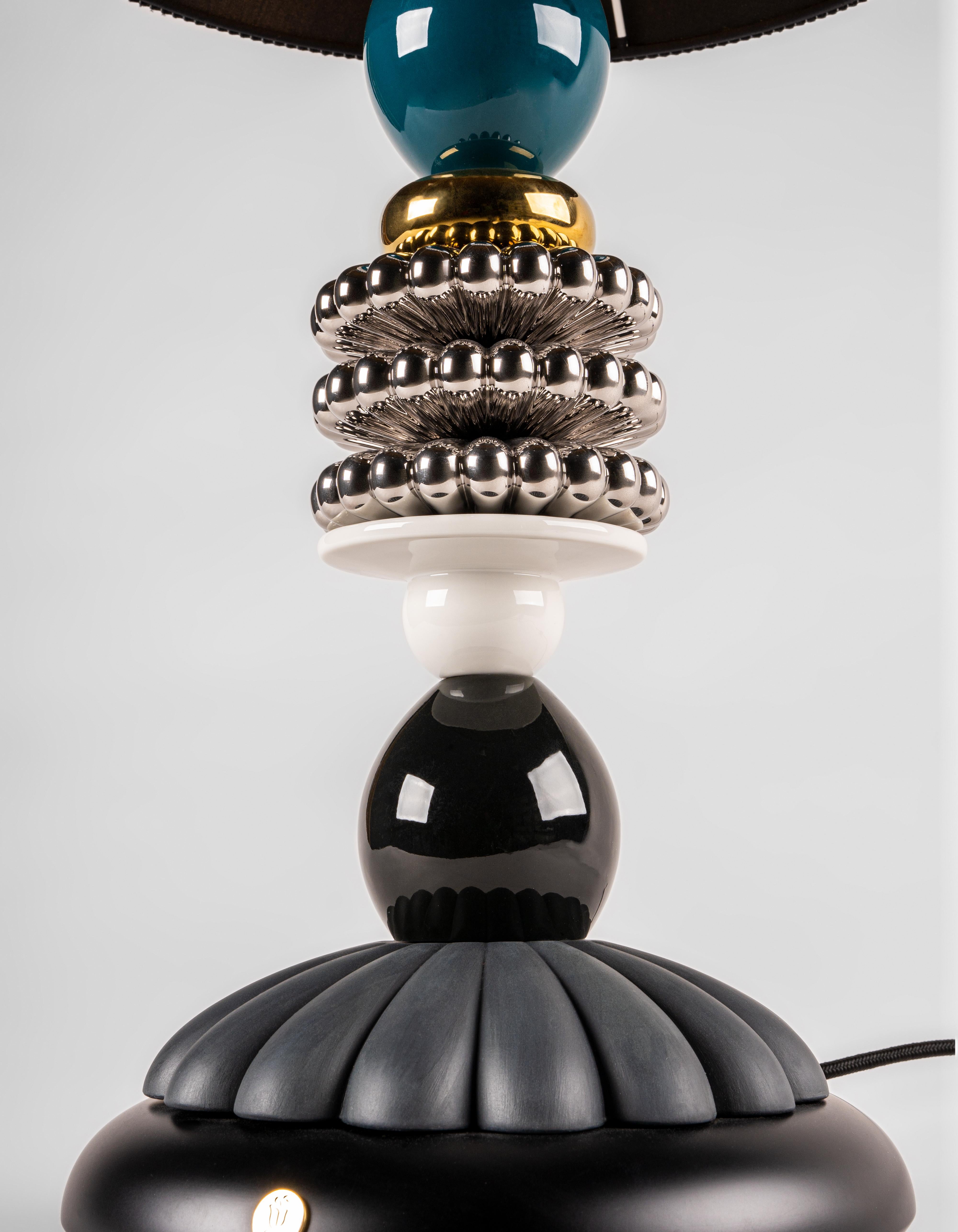 Tabletop lamp from the Firefly collection, taking on a new character in this version designed by the celebrated Mexican interior designer Olga Hanono. Olga Hanono, an interior designer internationally famous in the world of art and architecture,