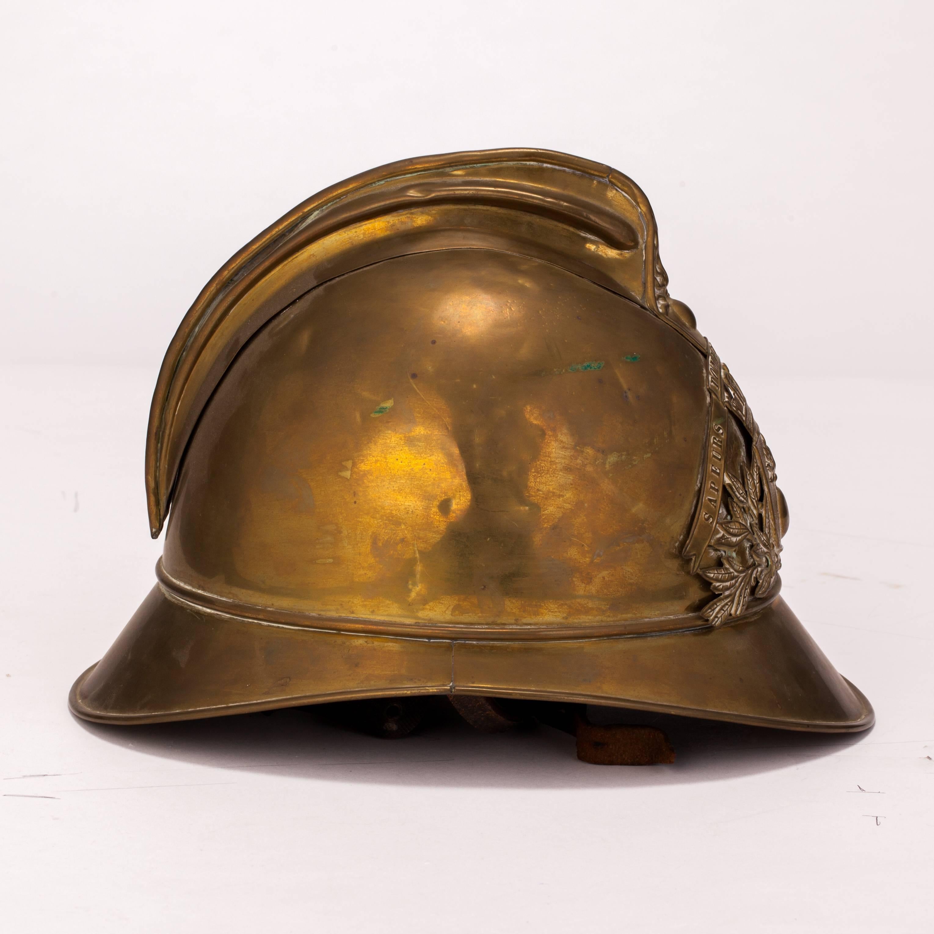Old helmet of the firemen of Saint Venant (between Lille and Dunkirk). The helmet is in brass with leather inside.