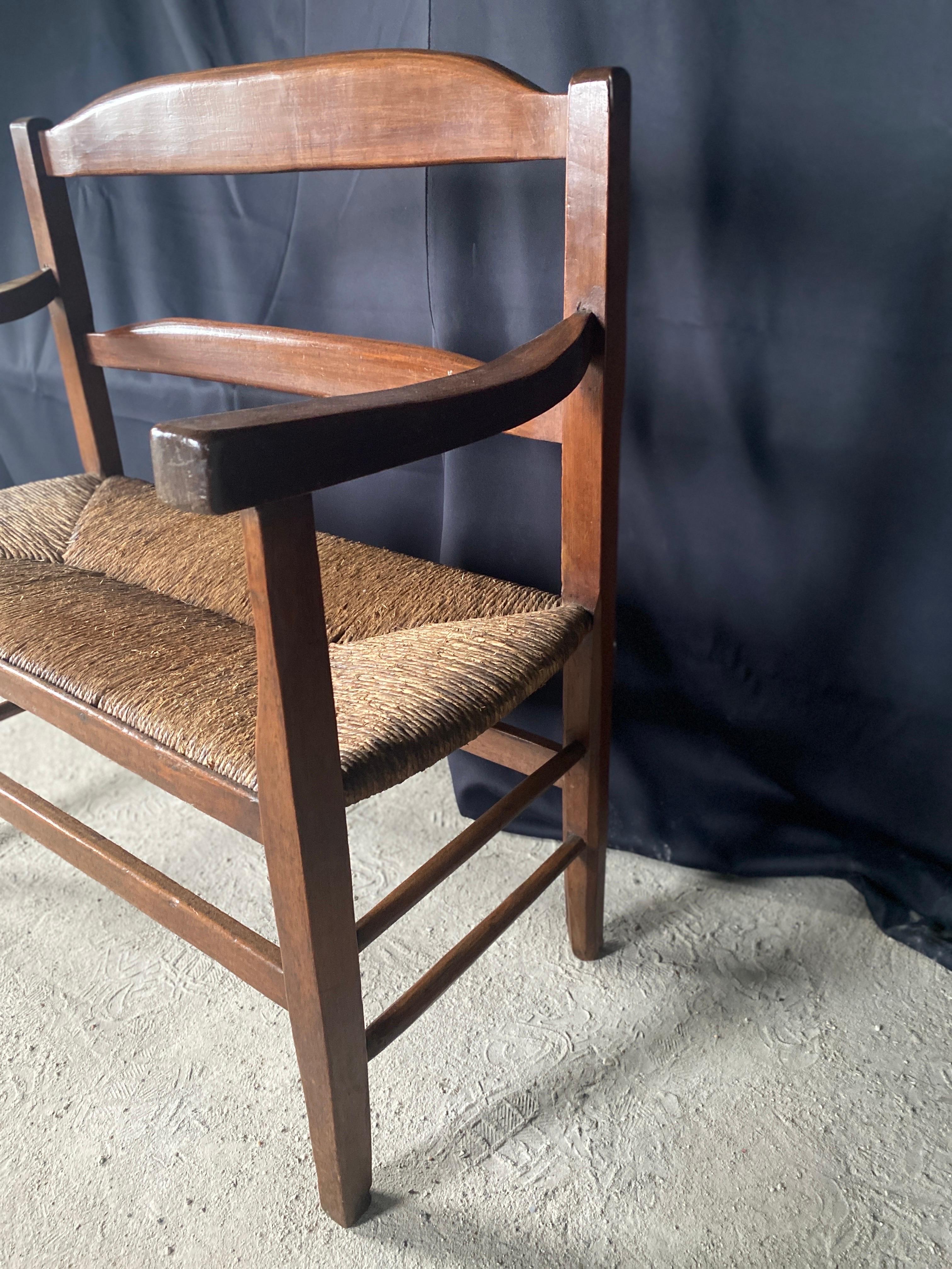 Walnut Fireplace bench dating from the 19th century straw seat For Sale