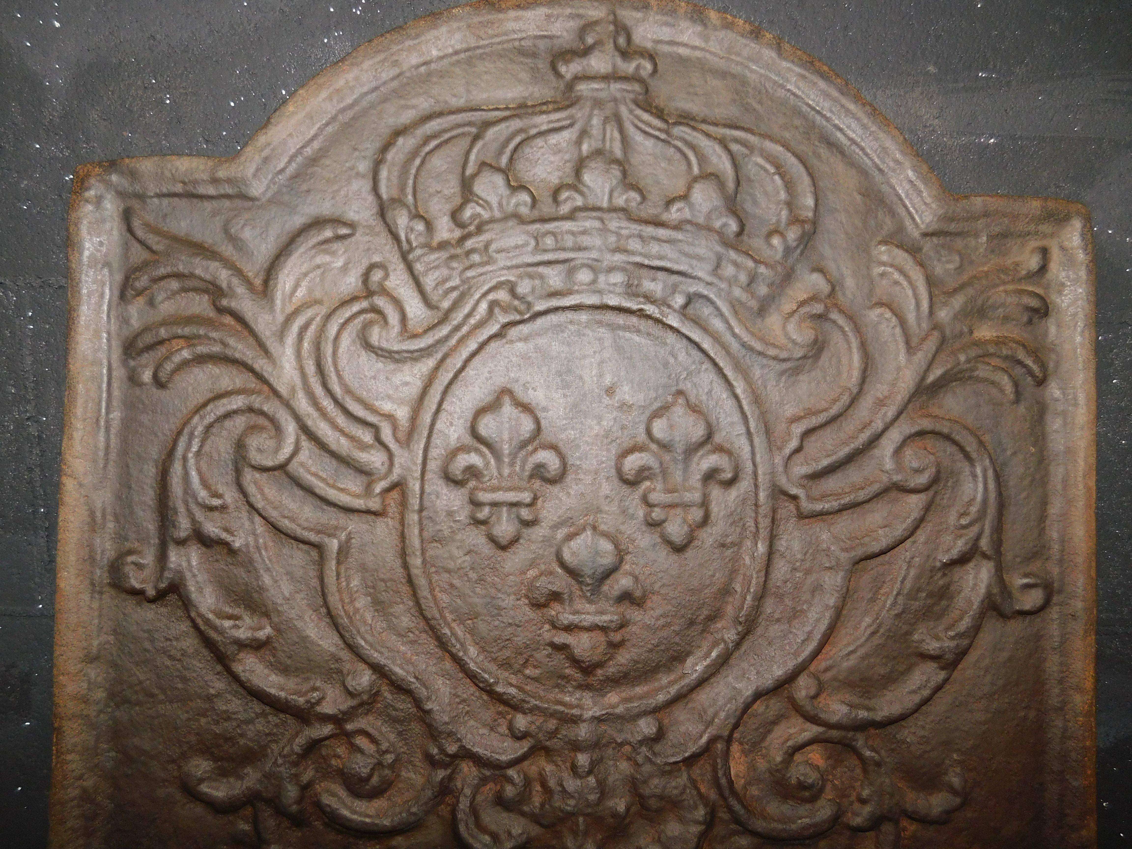 Hand-Carved Fireplace bottom plate in cast iron with lilies and crown For Sale