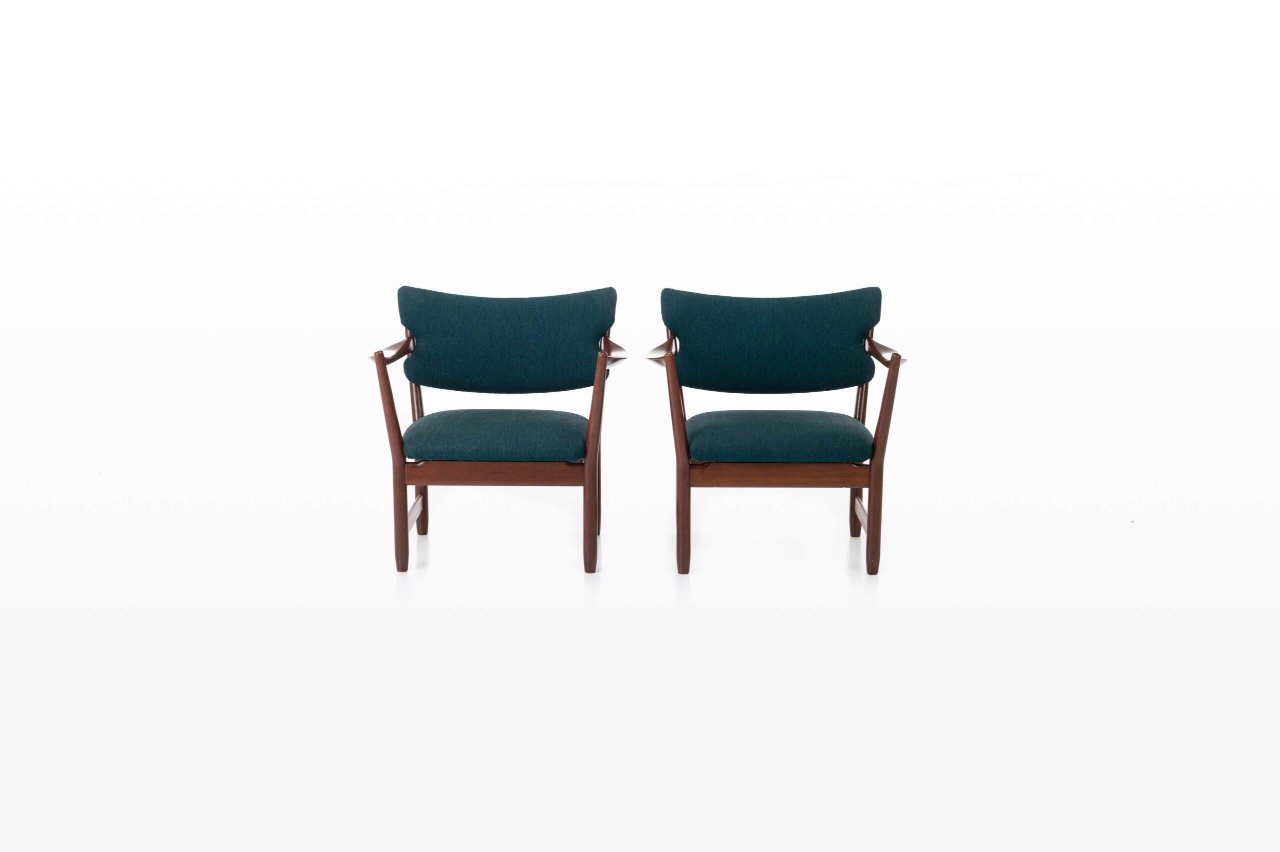 Beautiful set of two “Fire place” armchairs in teak. Designed by Fredrik Kayser and Adolf Relling for Dokka Møbler. Produced in Norway around 1958. The chairs have a teak frame and petrol blue upholstery.
 