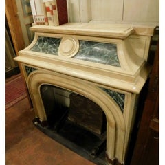 Fireplace mantel carved in yellow marble, green lacquered, Italy