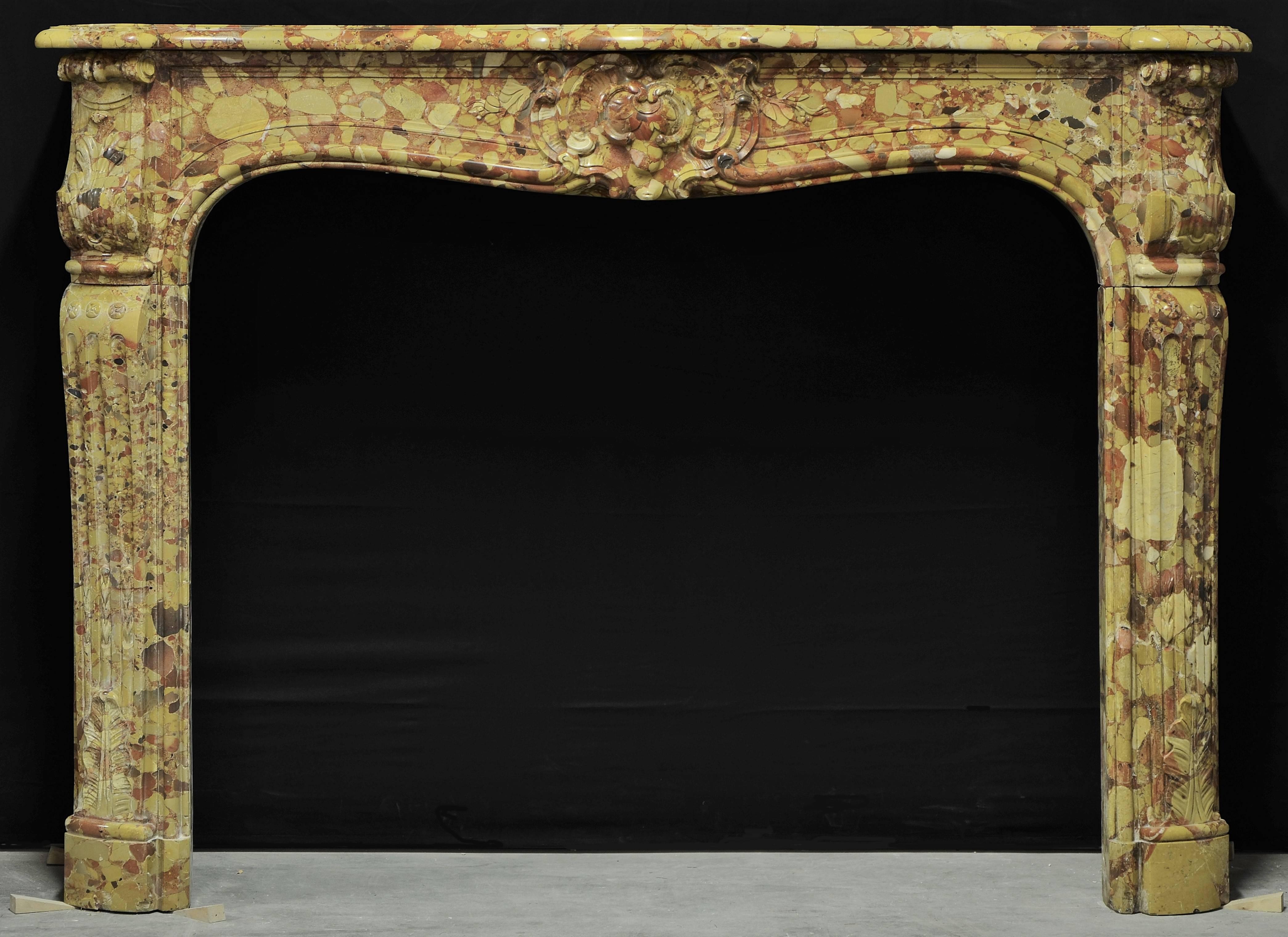 18th century Louis XV-XVI mantelpiece from Paris in rare Breche D' Allepe marble.
Beautifully decorated with great colors.

Has minor restorations and repairs. Truly amazing piece.

Inside measurements: 35.8 x 43.3 inch (height x width).