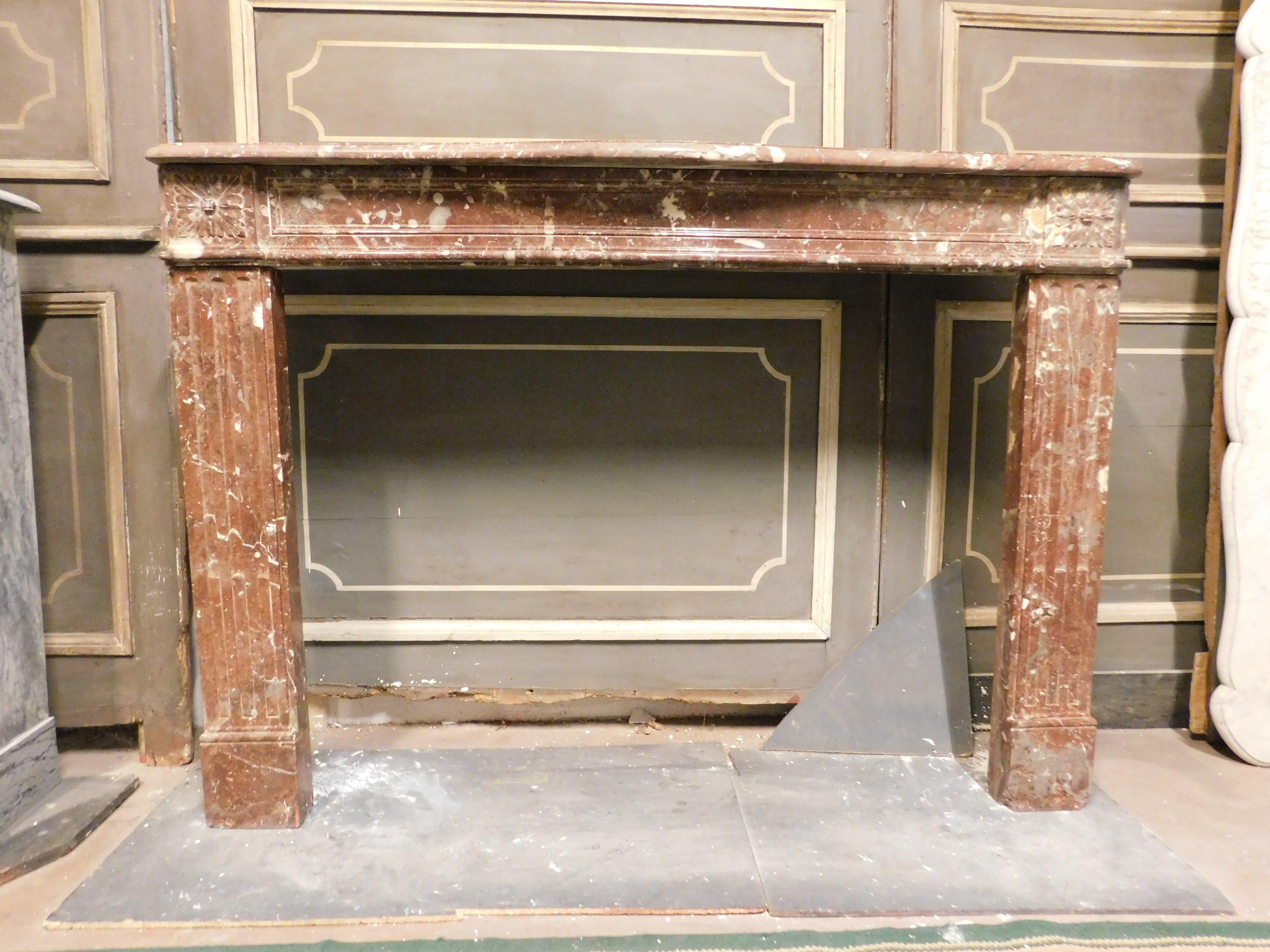Antique fireplace frame, carved in speckled marble called 