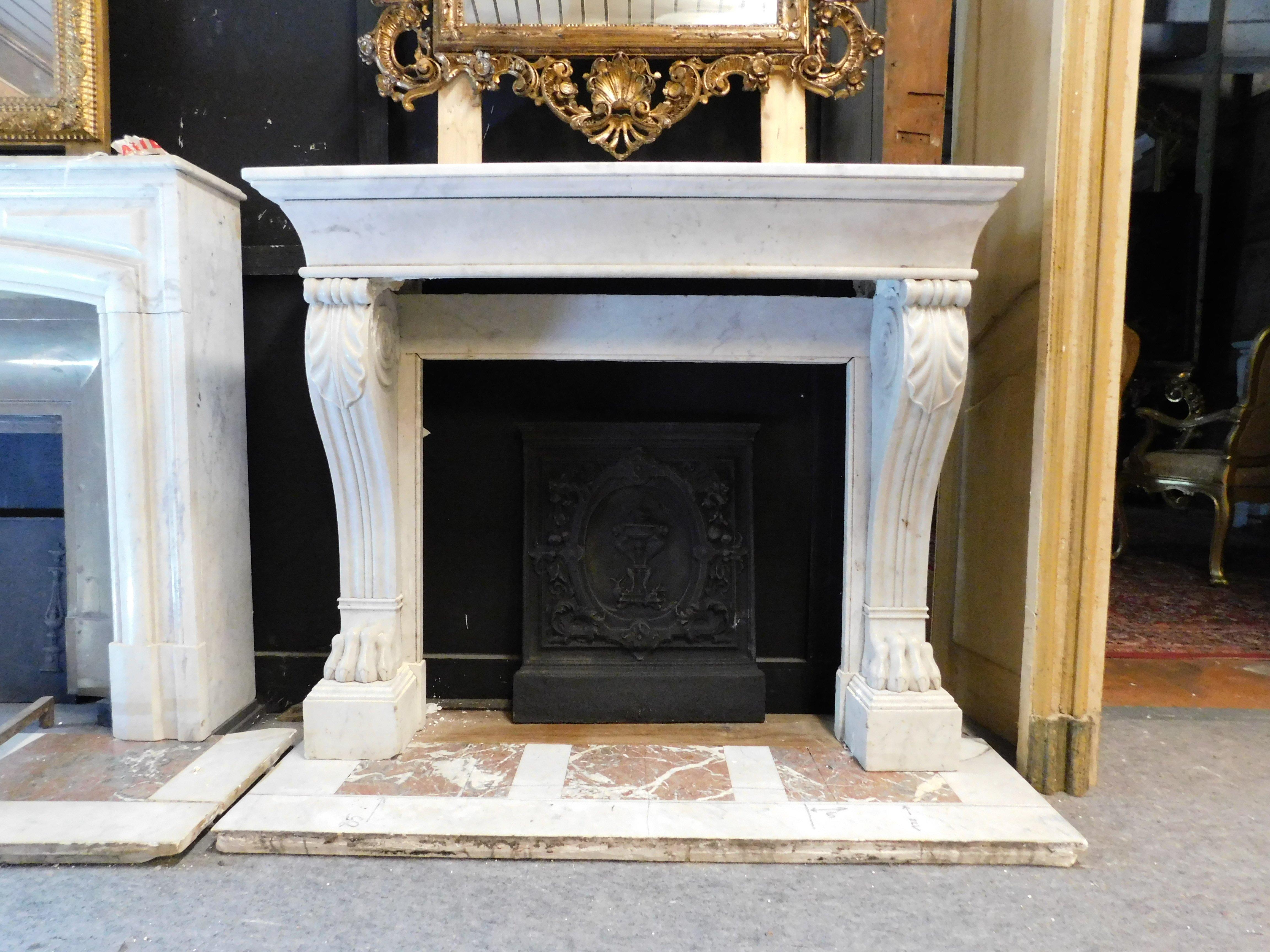 Ancient fireplace mantle, carved in white Carrara marble, with lion's paws and complete with original base, built in the 19th century, in Italy for a house in the historic center. Also ideal in modern houses and apartments, given the small