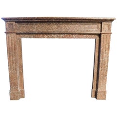 Fireplace mantle carved in red "breccia pernice" marble, Italy