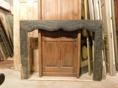 Fireplace mantle in black lacquered solid wood with floral carvings, Italy