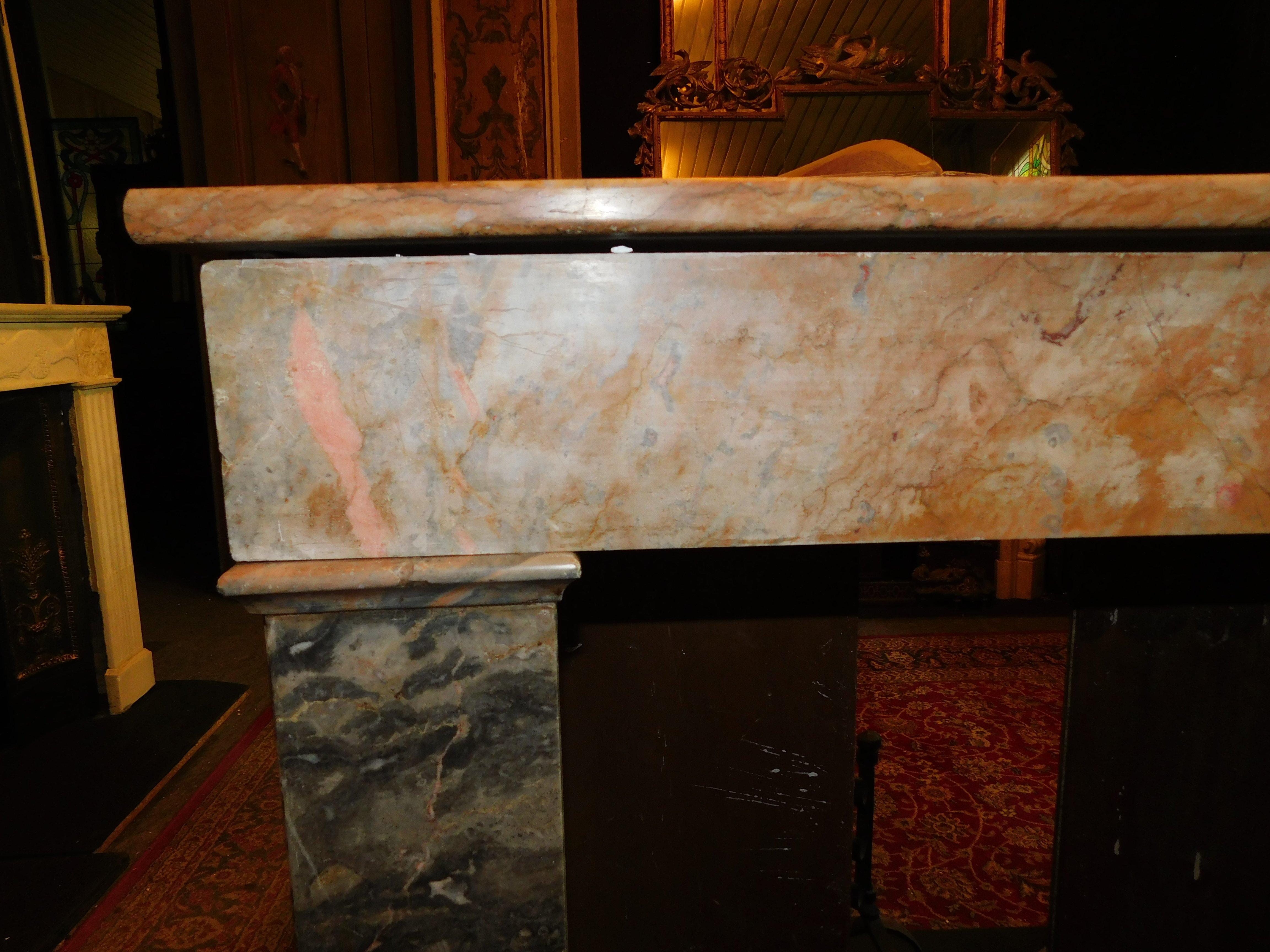 Fireplace mantle in gray and pink marble 