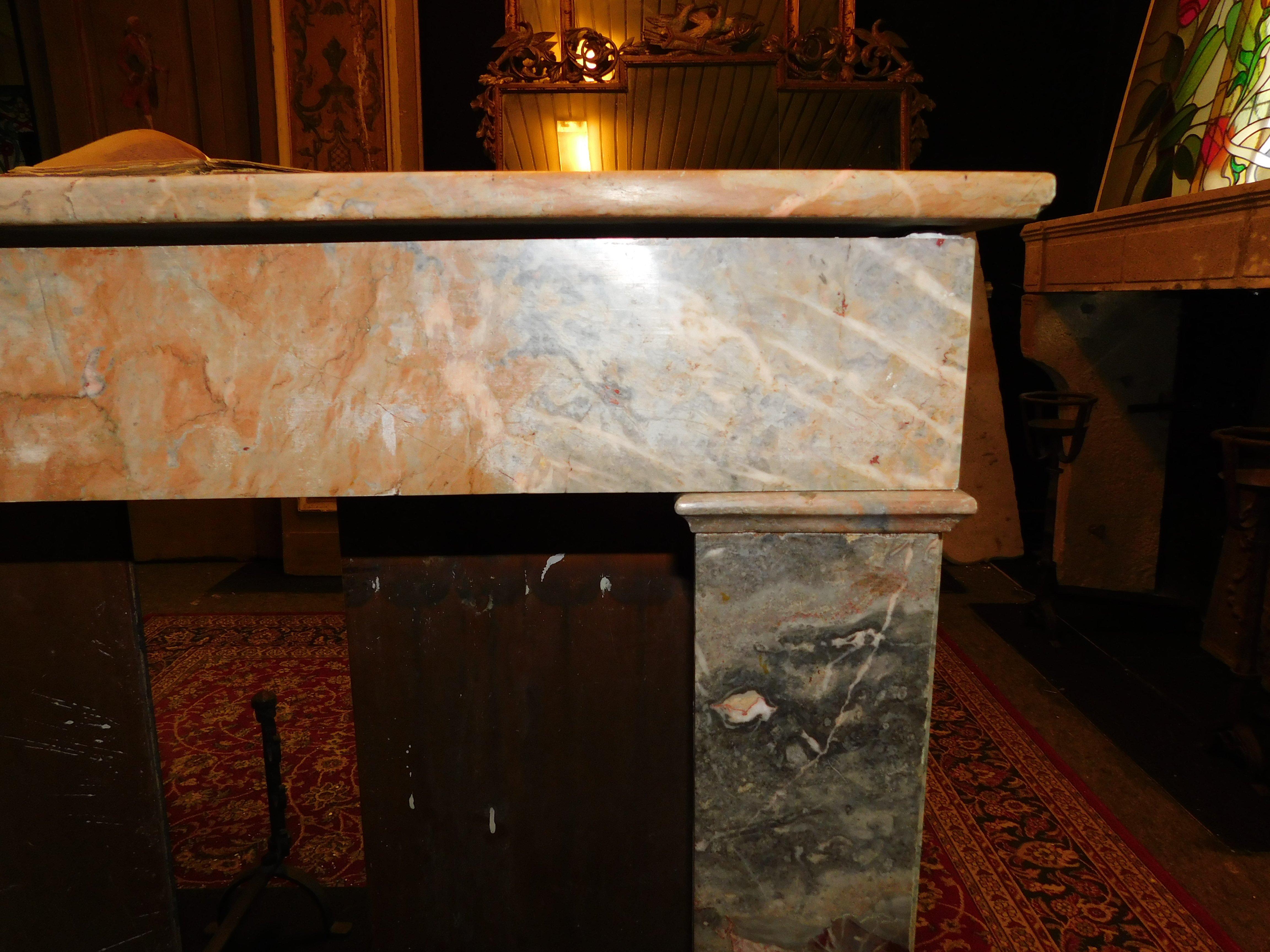 Fireplace mantle in gray and pink marble 