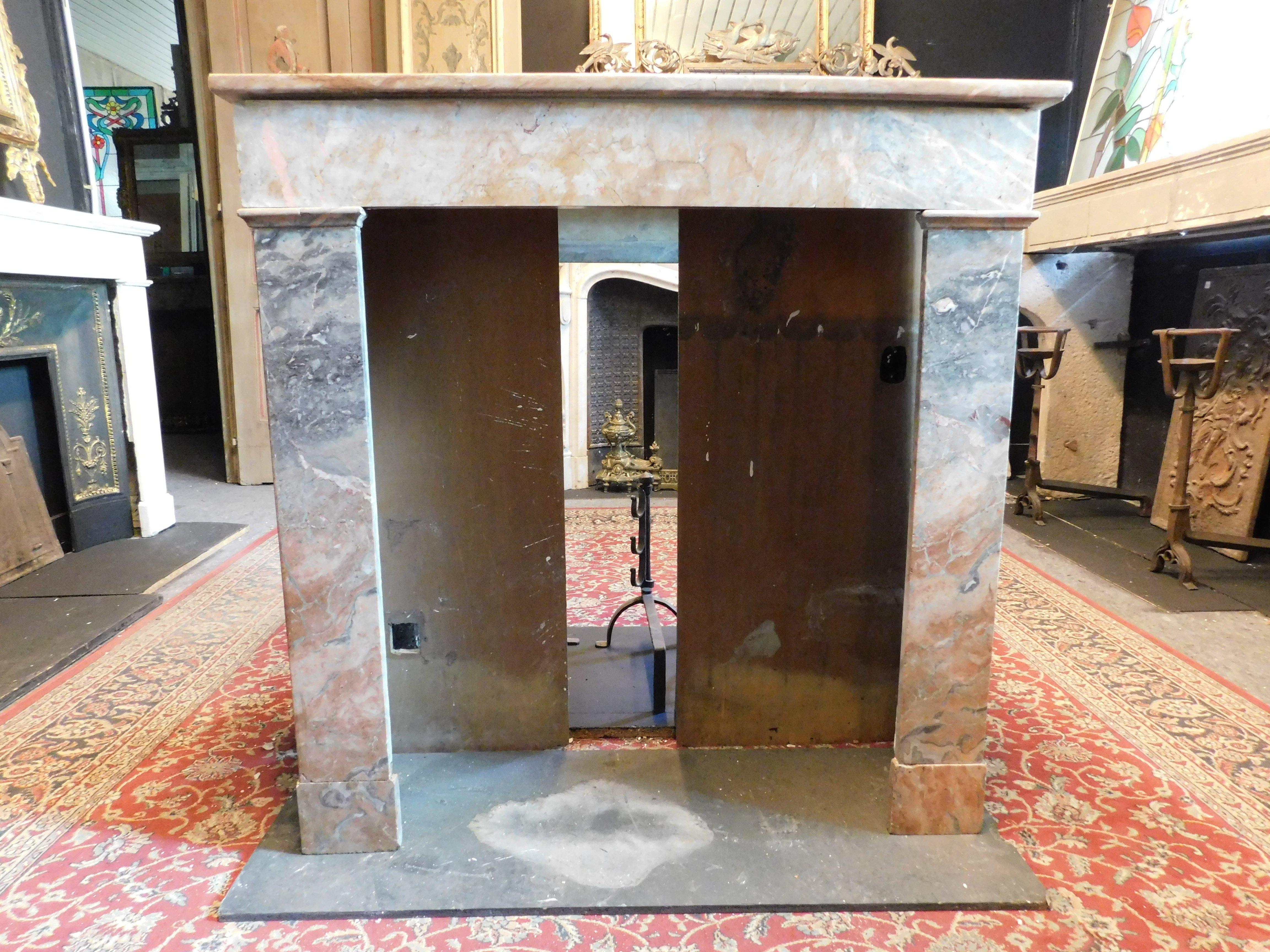 Fireplace mantle in gray and pink marble 