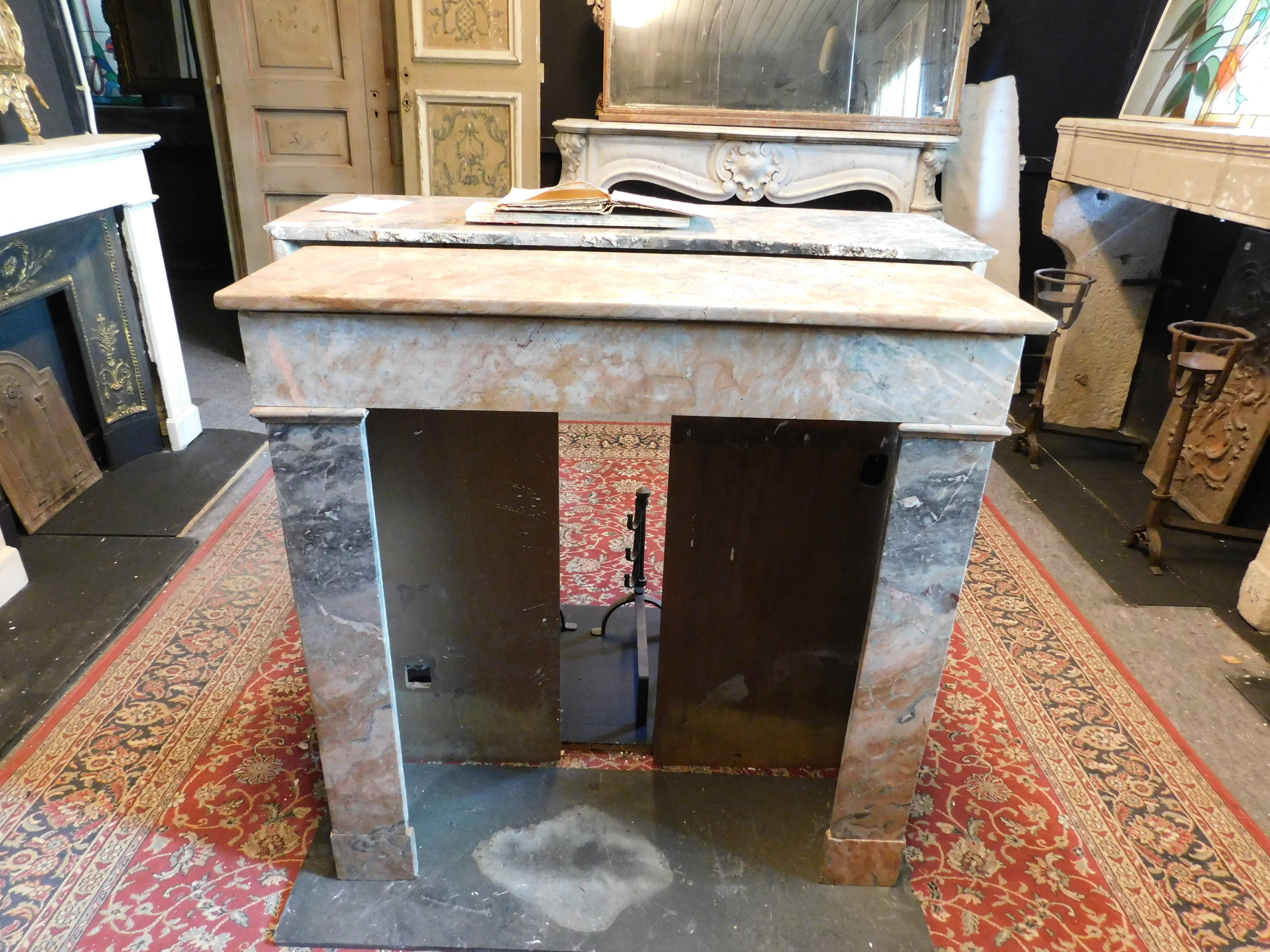 Fireplace mantle in gray and pink marble 