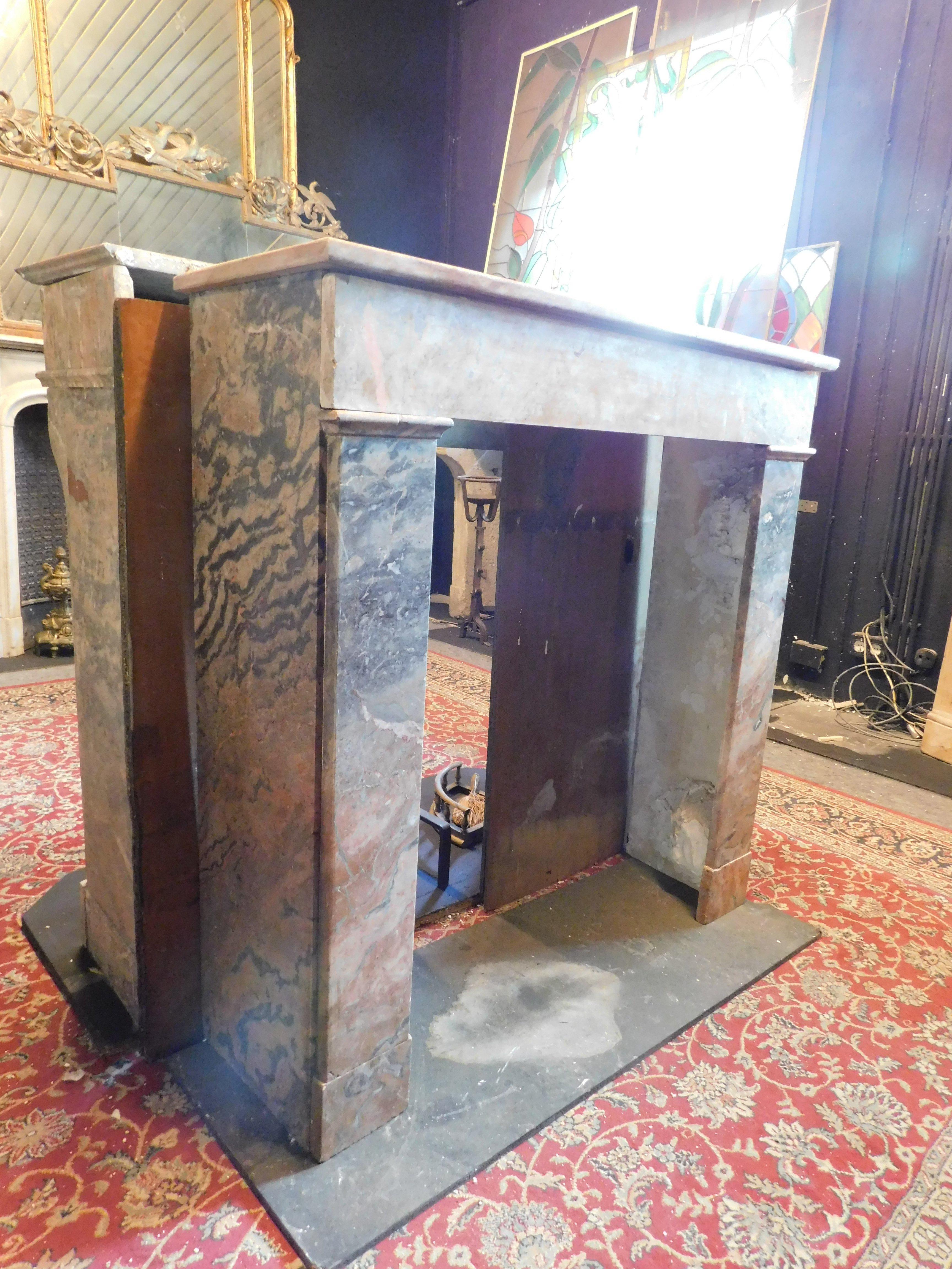 Fireplace mantle in gray and pink marble 