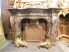 Fireplace mantle in "Rosso Levanto" marble, carved in volutes, Genoa Italy