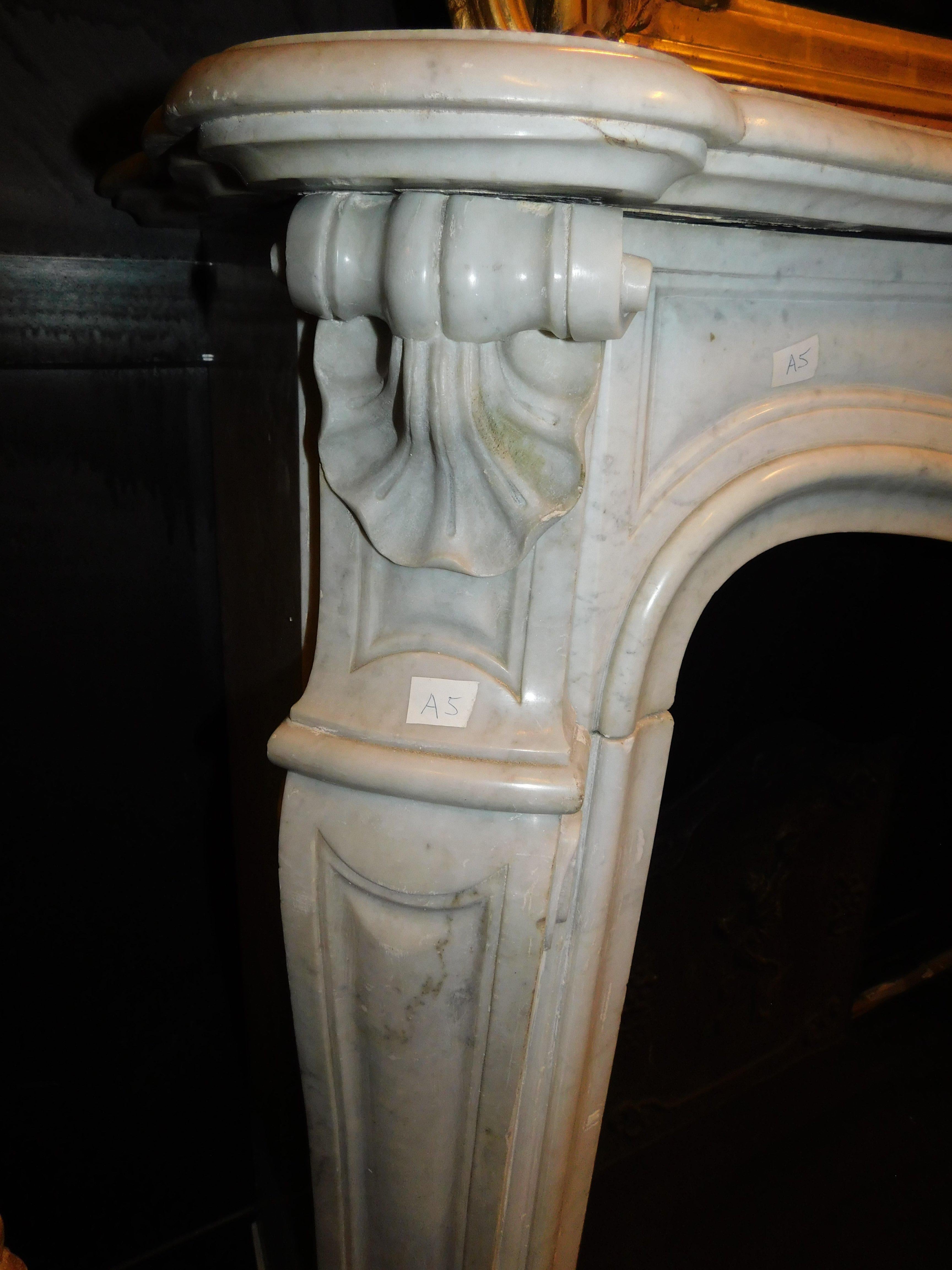 Fireplace mantle in white Carrara marble, carved with a central shell, France 3