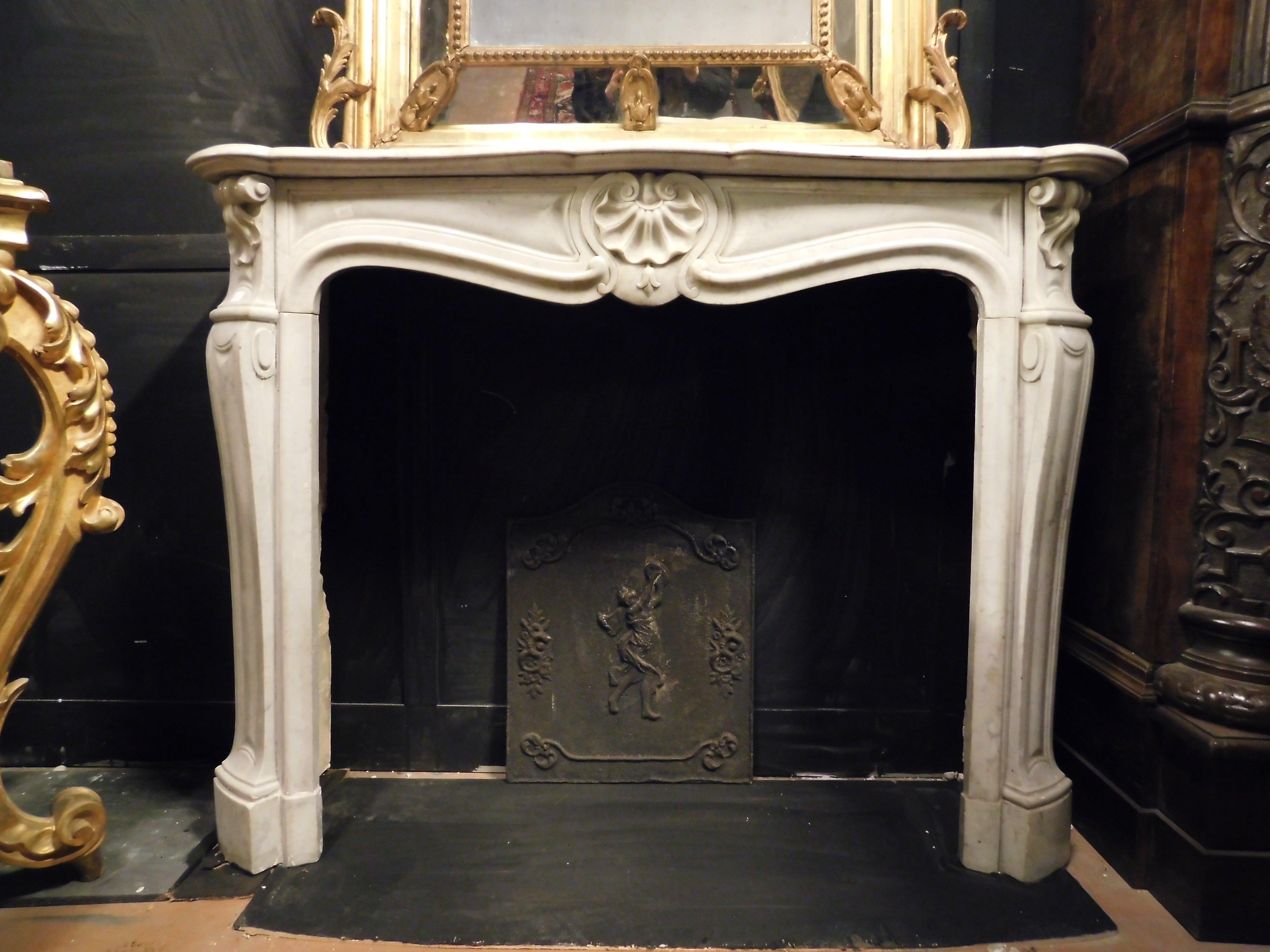 French Fireplace mantle in white Carrara marble, carved with a central shell, France
